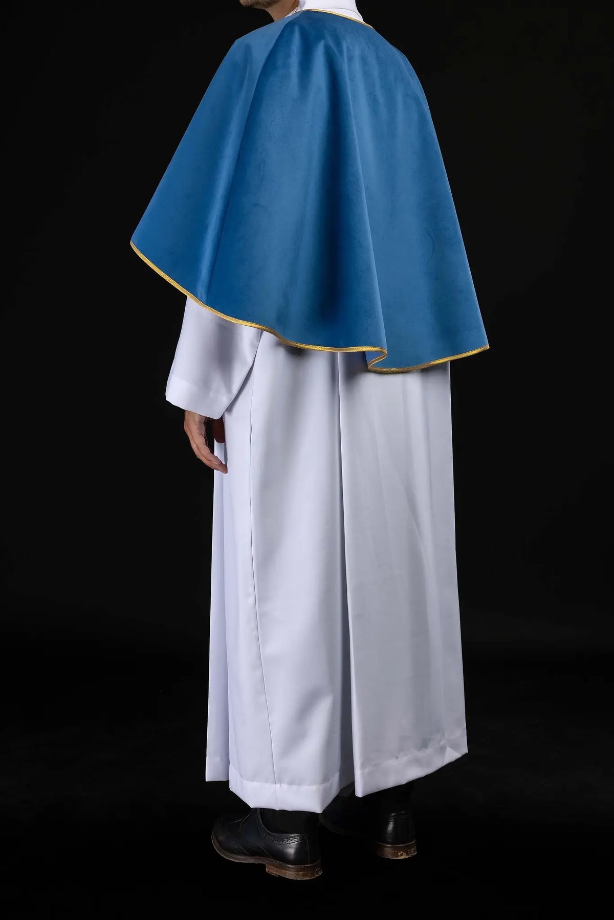 Blue altar server cape with gold trim, back three-quarter view