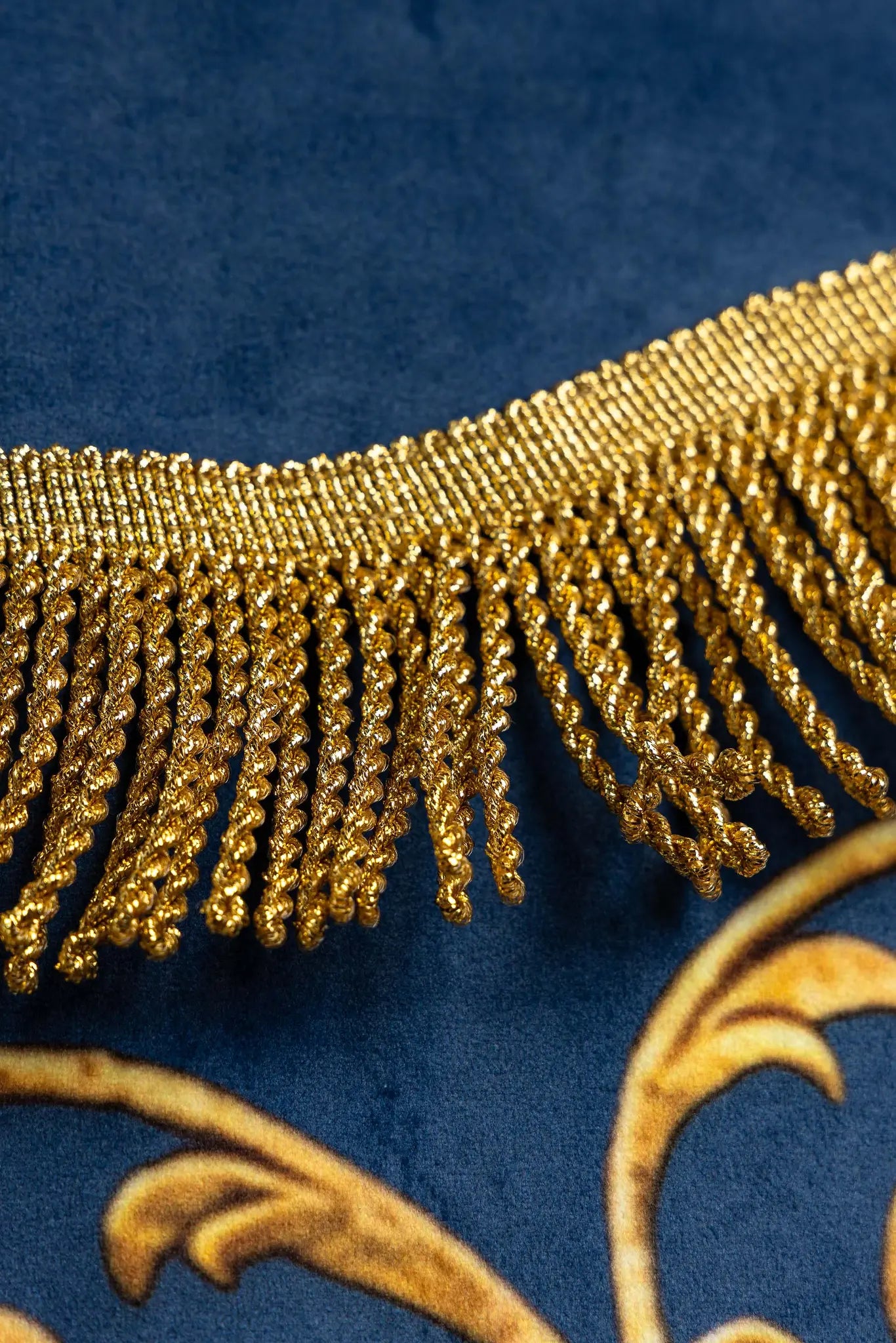 Double-sided blue processional banner with an image of Our Lady of the Immaculate Conception on one side and a Marian monogram on the other, both surrounded by gold floral ornamentation and finished with gold fringes.