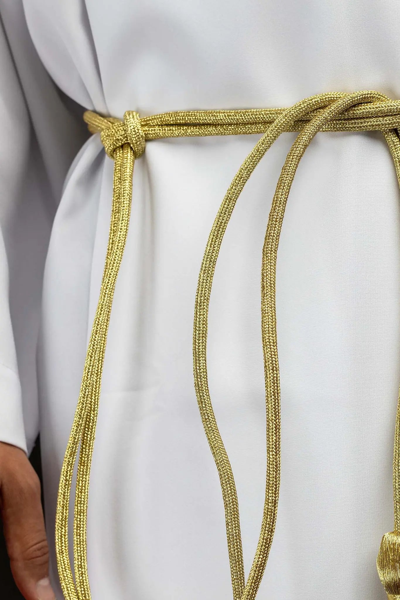 Gold liturgical cincture with decorative tassels made from braided cord