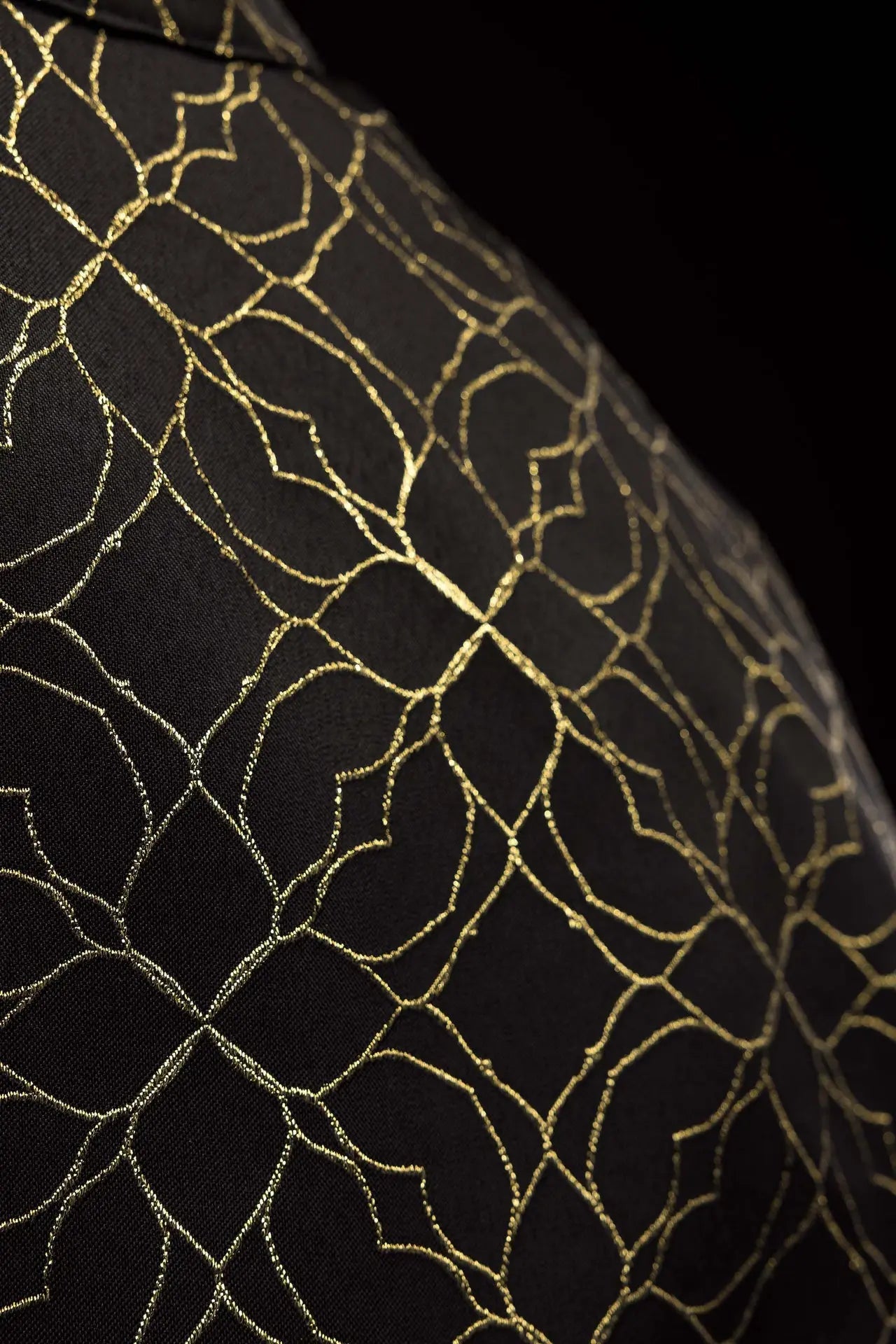 Embroidered black cope decorated with jacquard fabric