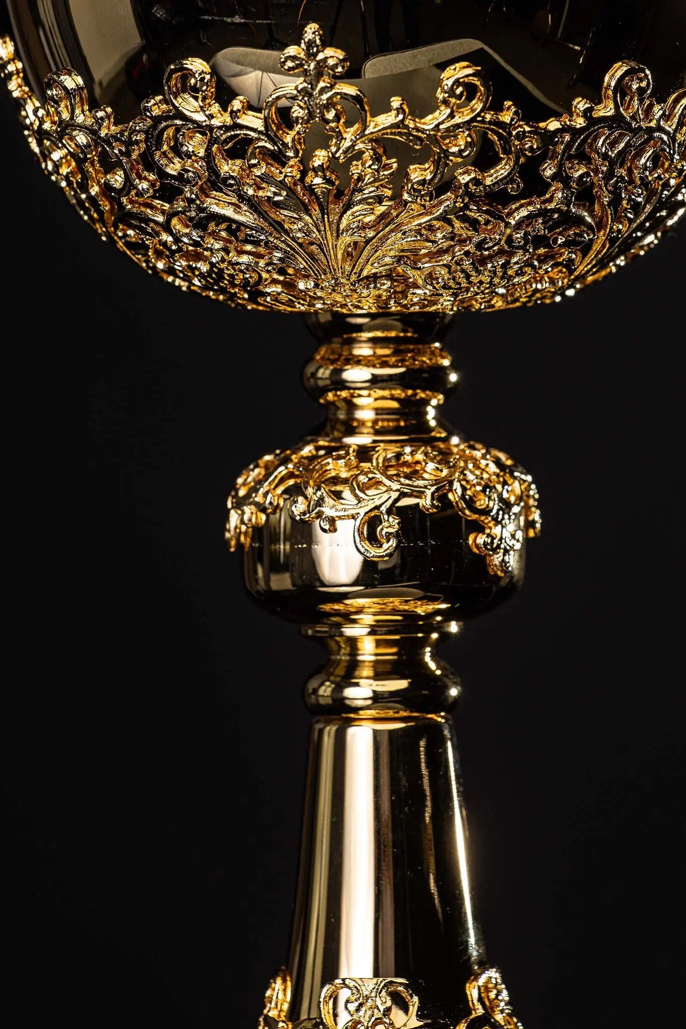 Handmade gold-plated ciborium with floral ornamentation and blue imitation sapphires, topped with a cross.