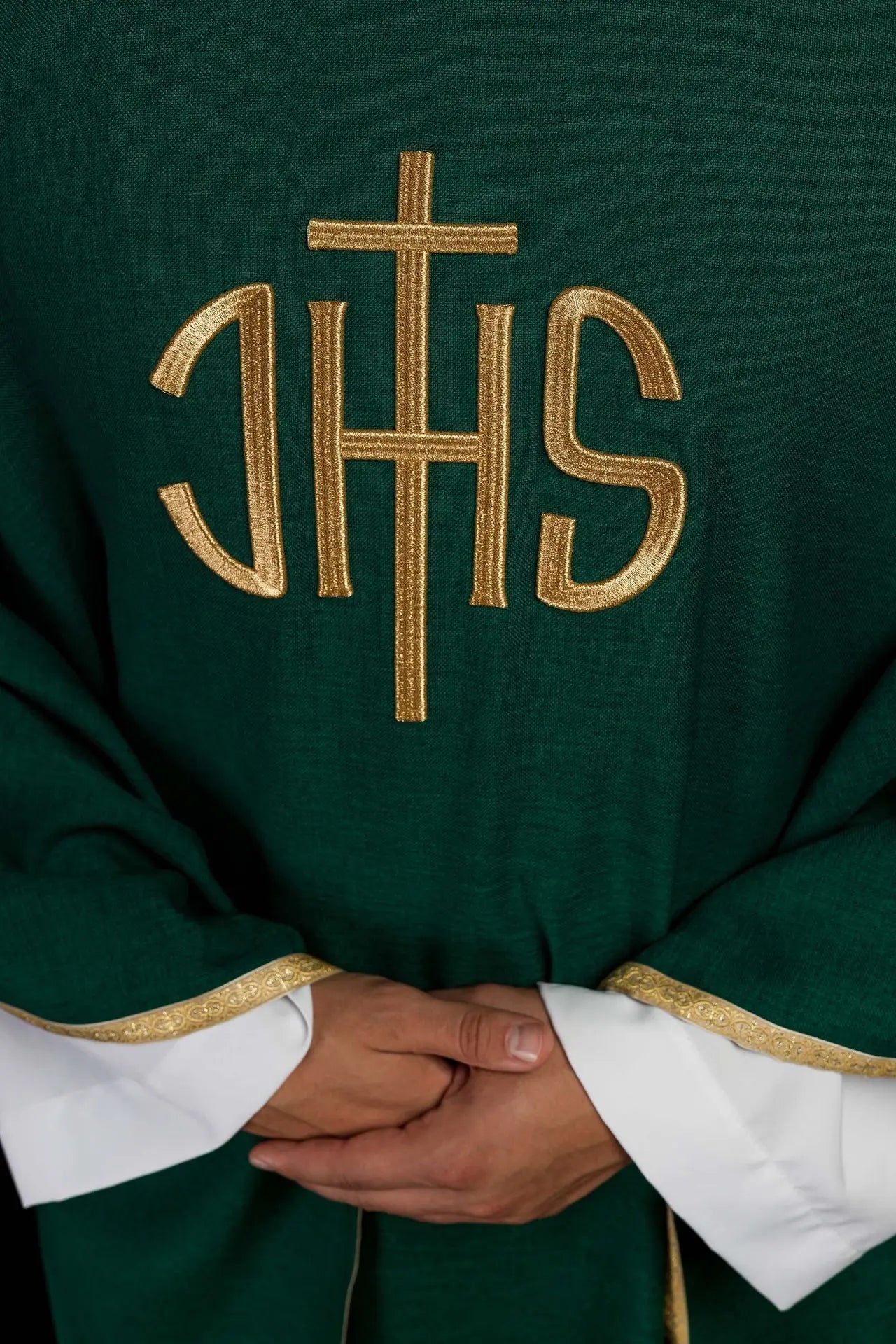 Green liturgical chasuble with a gold IHS embroidery