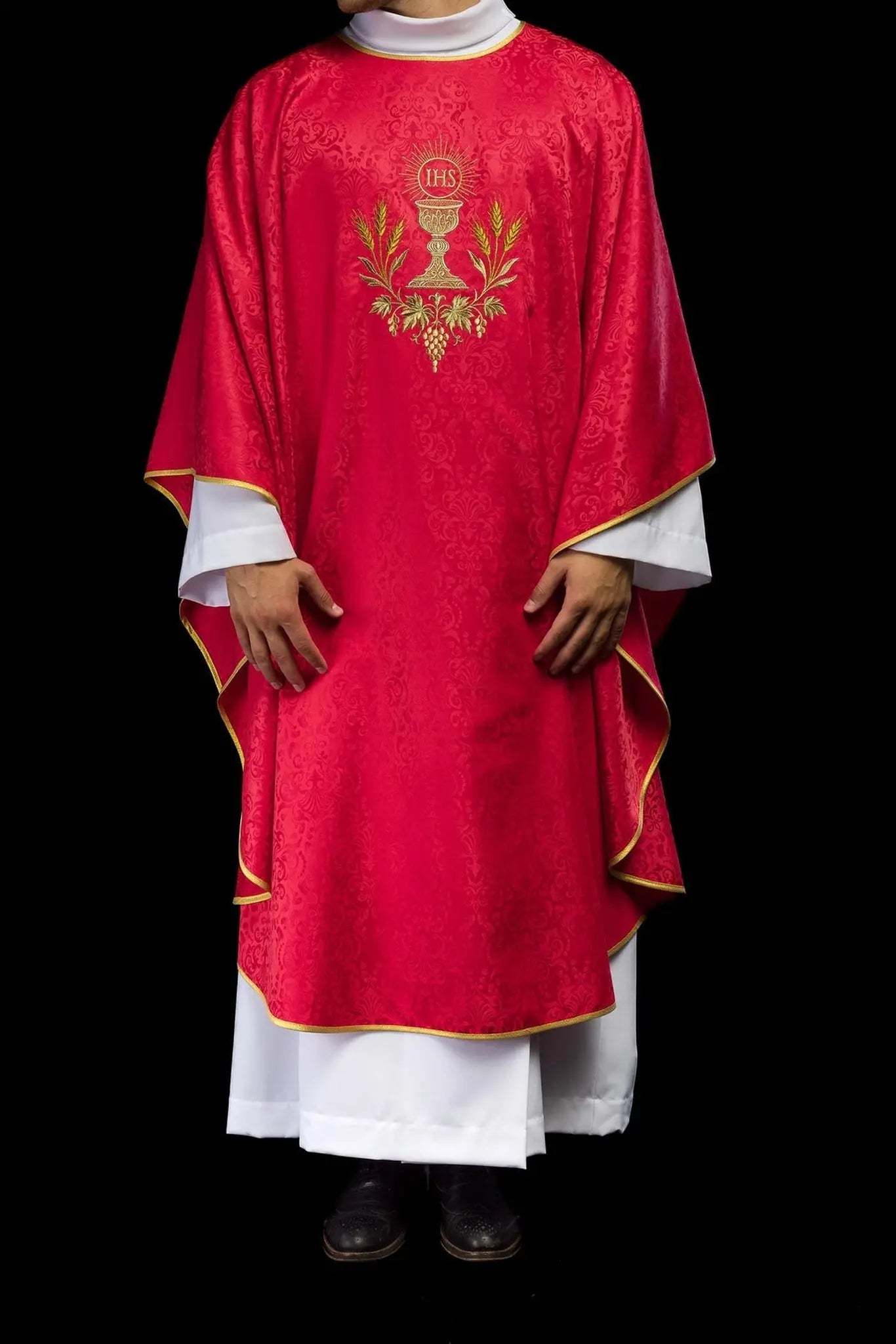 Red liturgical chasuble with an embroidered chalice and host on jacquard fabric