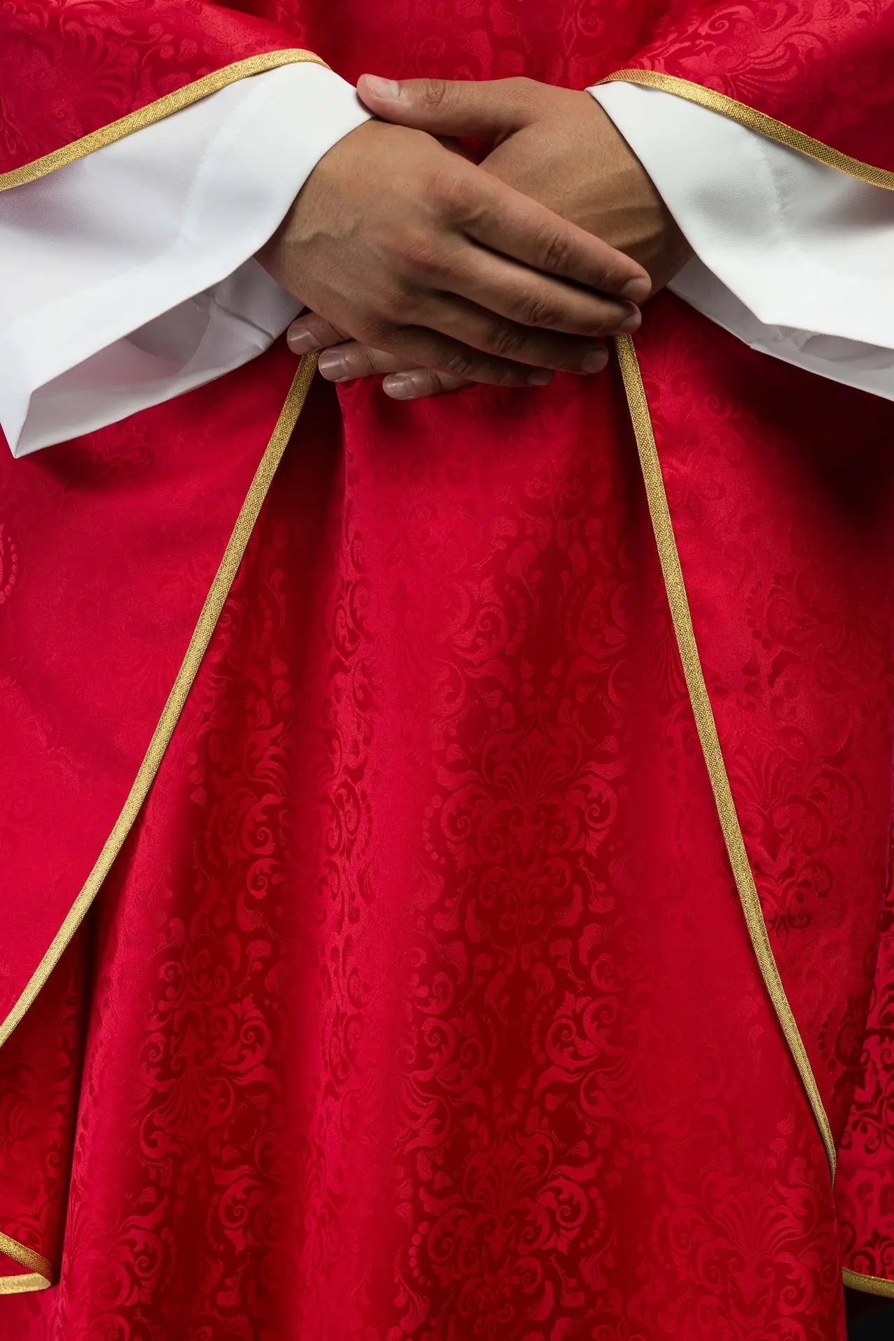 Red liturgical chasuble with an embroidered chalice and host on jacquard fabric