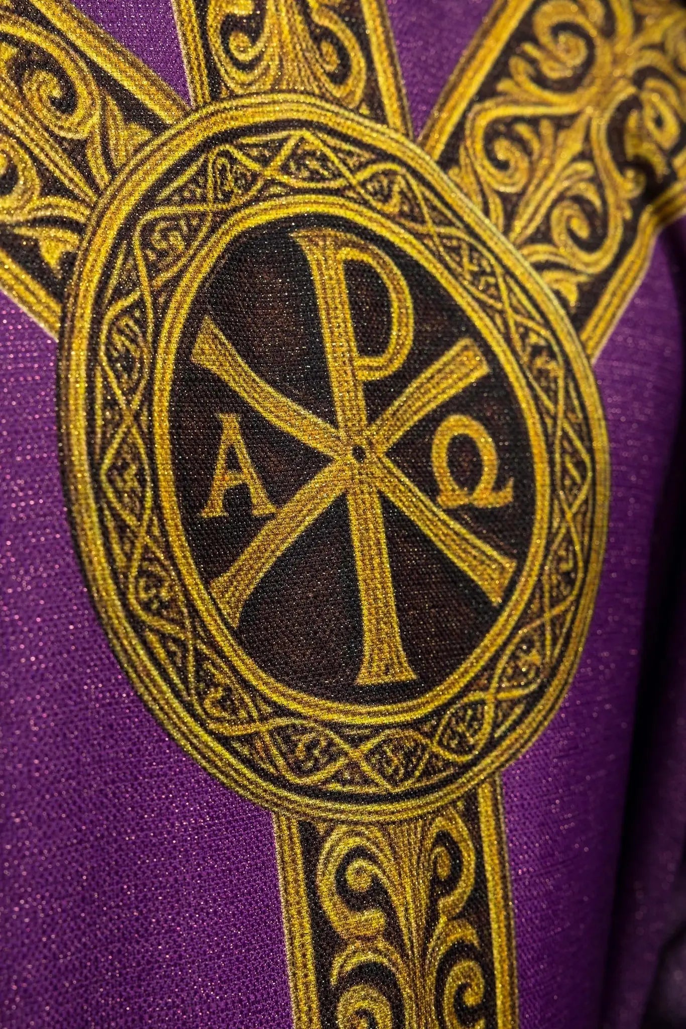 Purple printed “Pax” chasuble with rich gold decoration