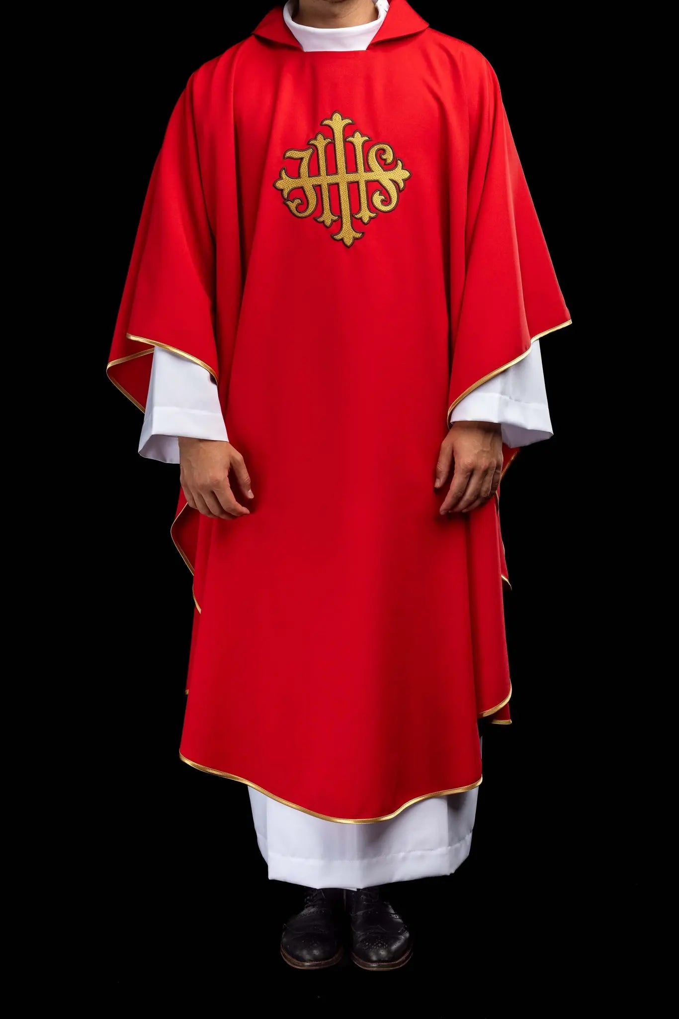 Red chasuble with gold IHS embroidery on the front and back, finished with gold trim and a V-neckline.