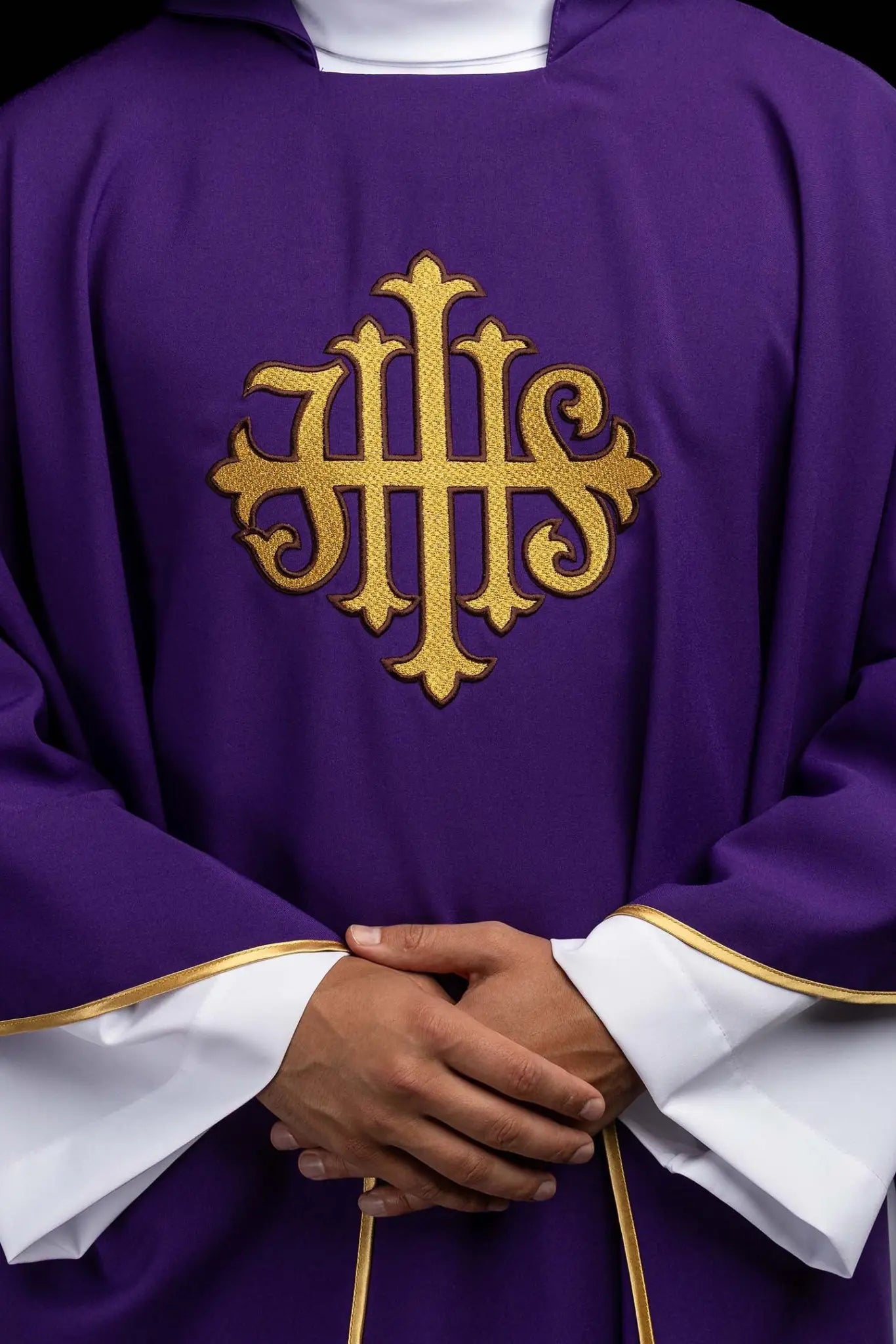 Purple chasuble with embroidered IHS symbol and gold trim, featuring a V-neckline and a matching stole.