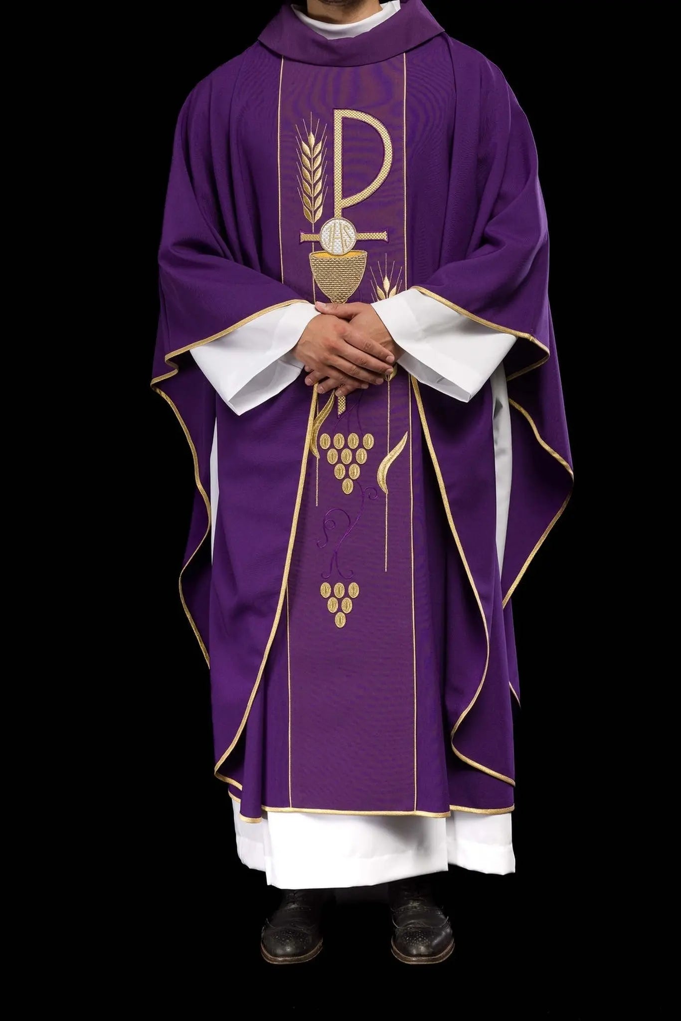 Purple chasuble embroidered with IHS chalice pattern