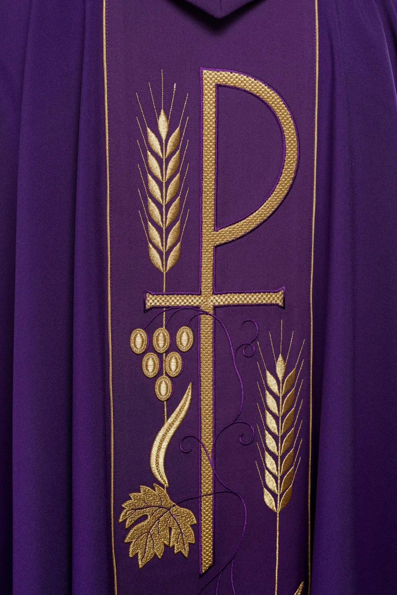 Purple chasuble embroidered with IHS chalice pattern