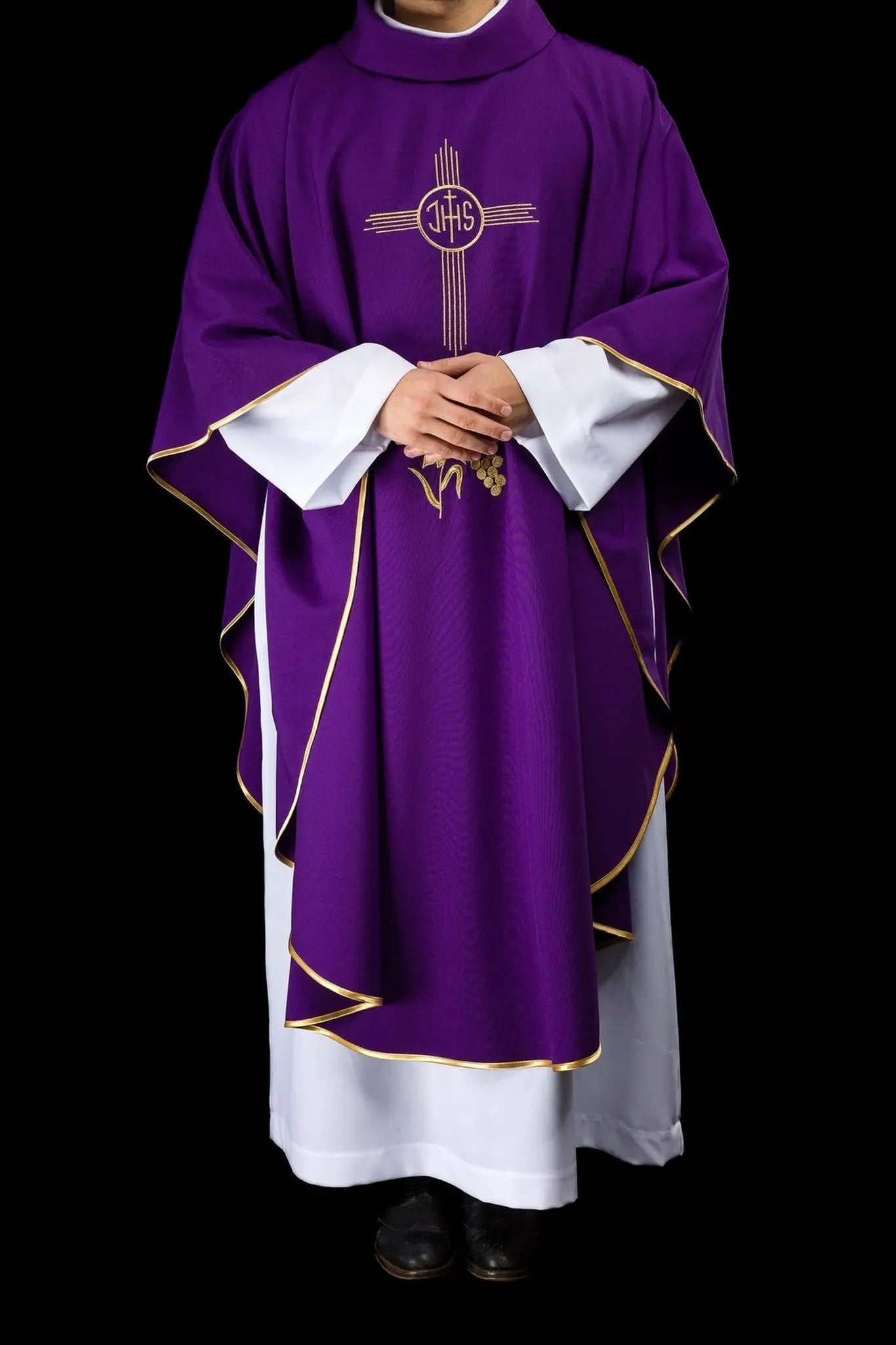 Purple chasuble embroidered with IHS motif