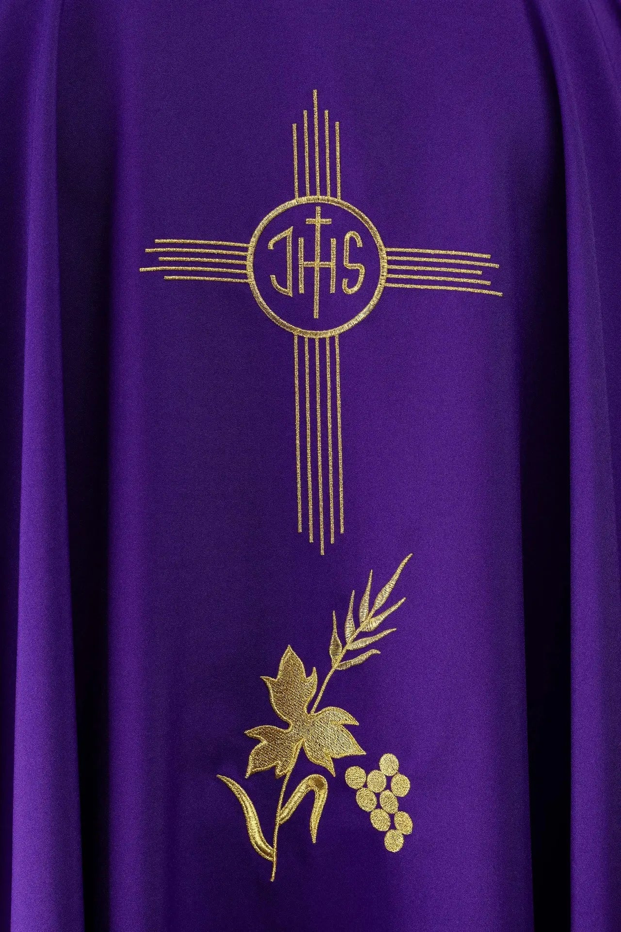 Purple chasuble embroidered with IHS motif