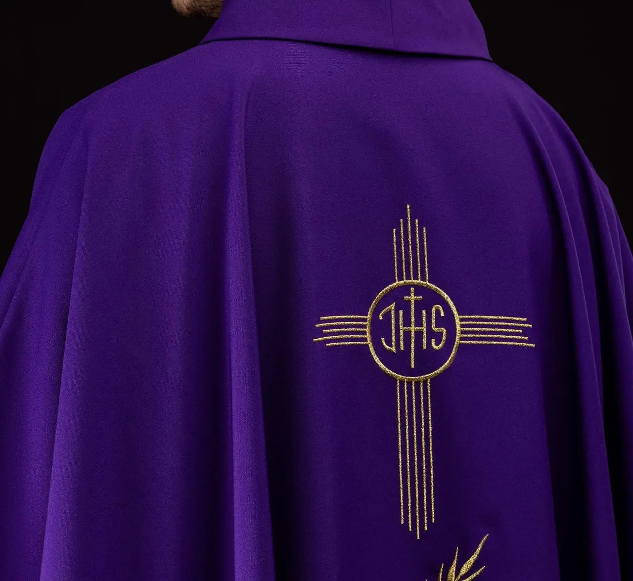 Purple chasuble embroidered with IHS motif