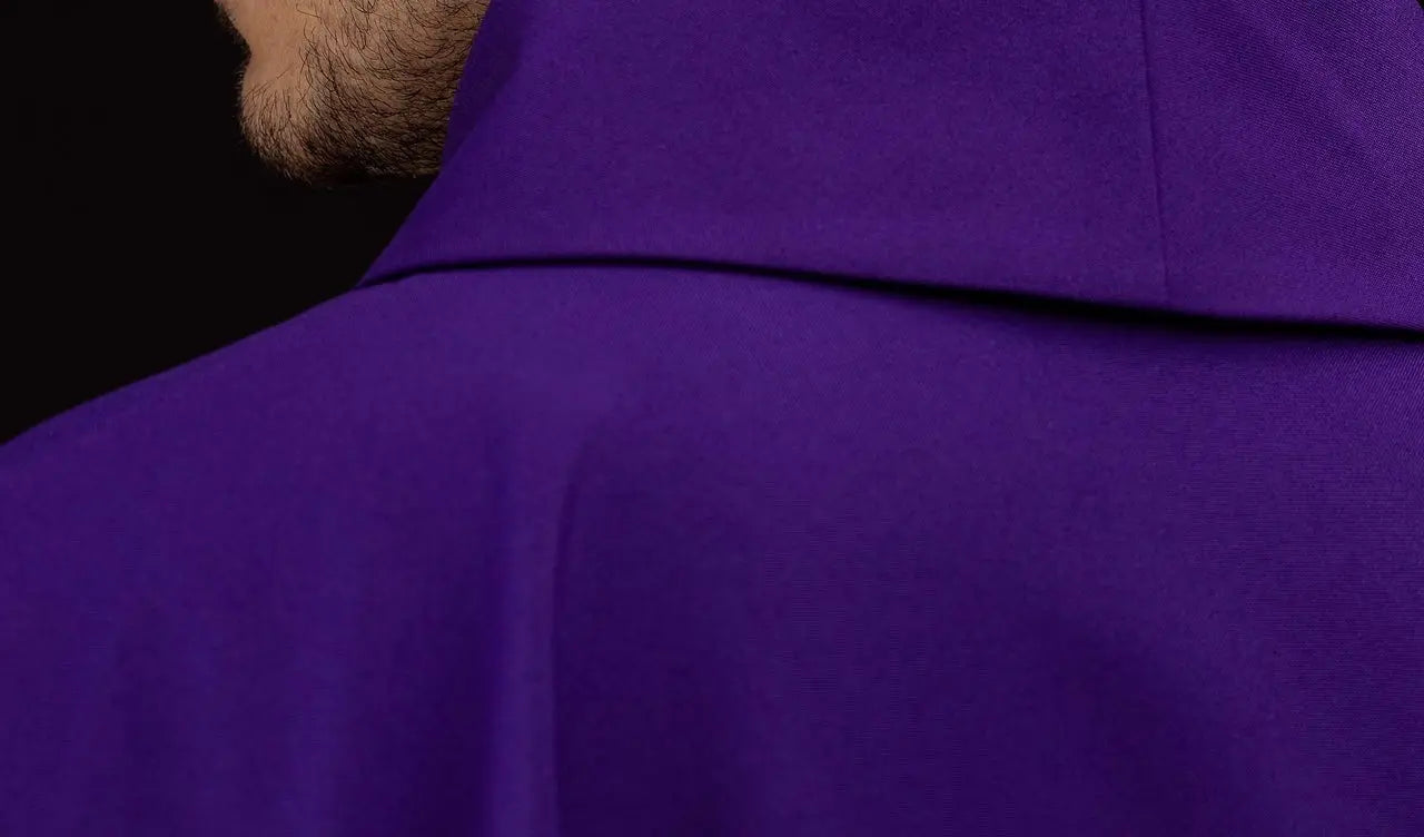 Purple chasuble embroidered with IHS motif