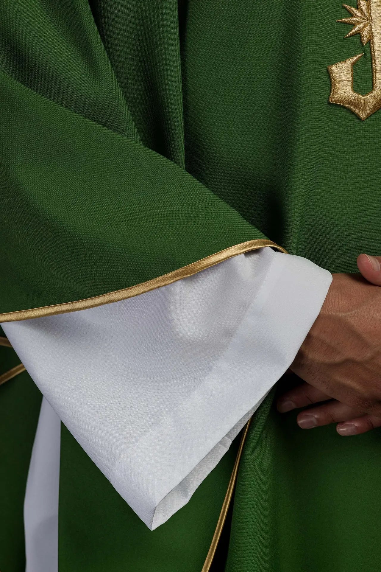 Green embroidered chasuble with gold IHS motif