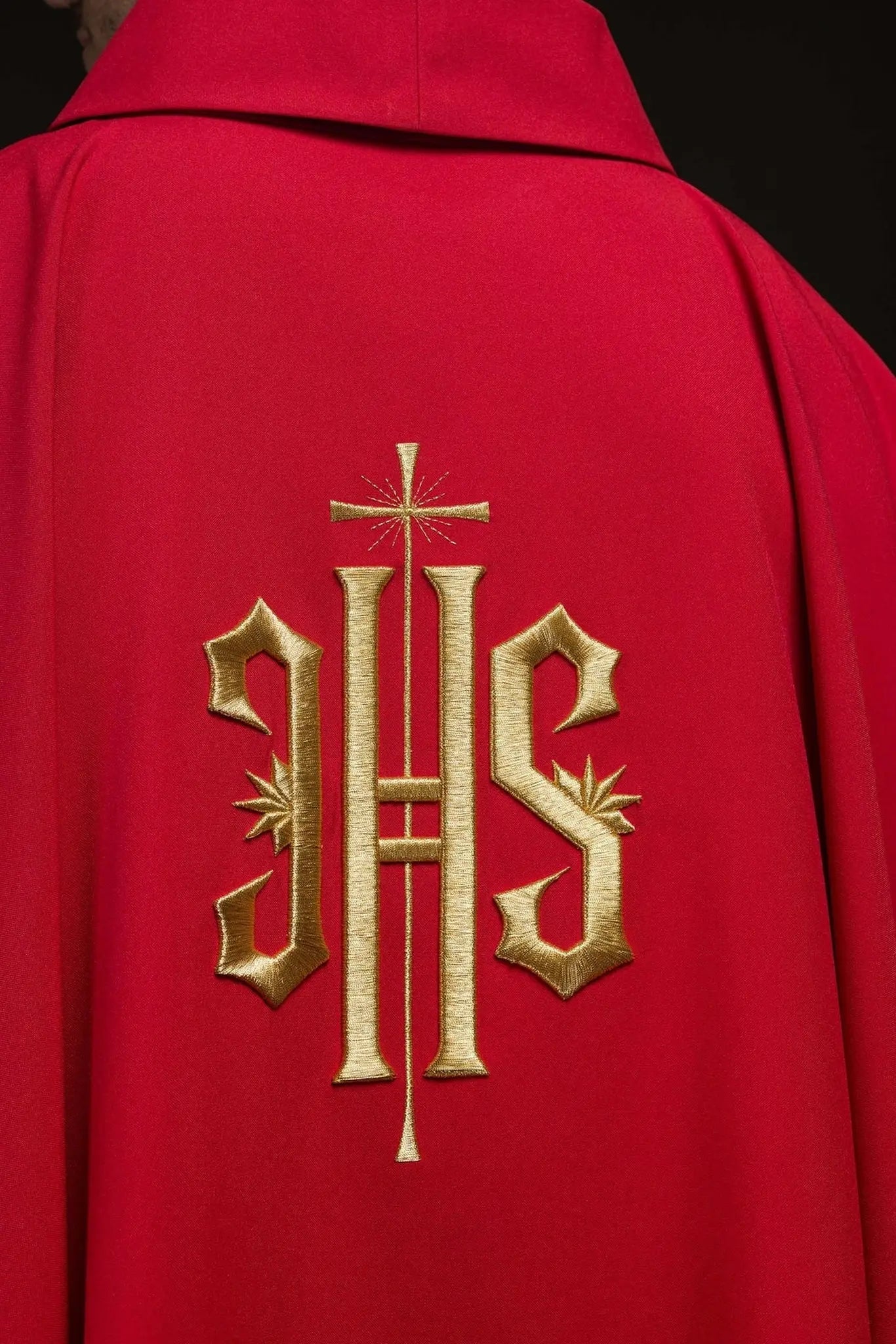 Red chasuble embroidered with gold IHS motif