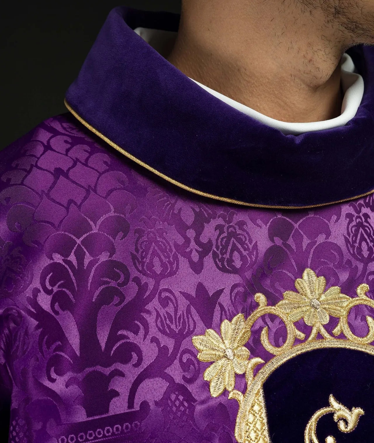 Purple chasuble embroidered with pattern of Jesus Christ