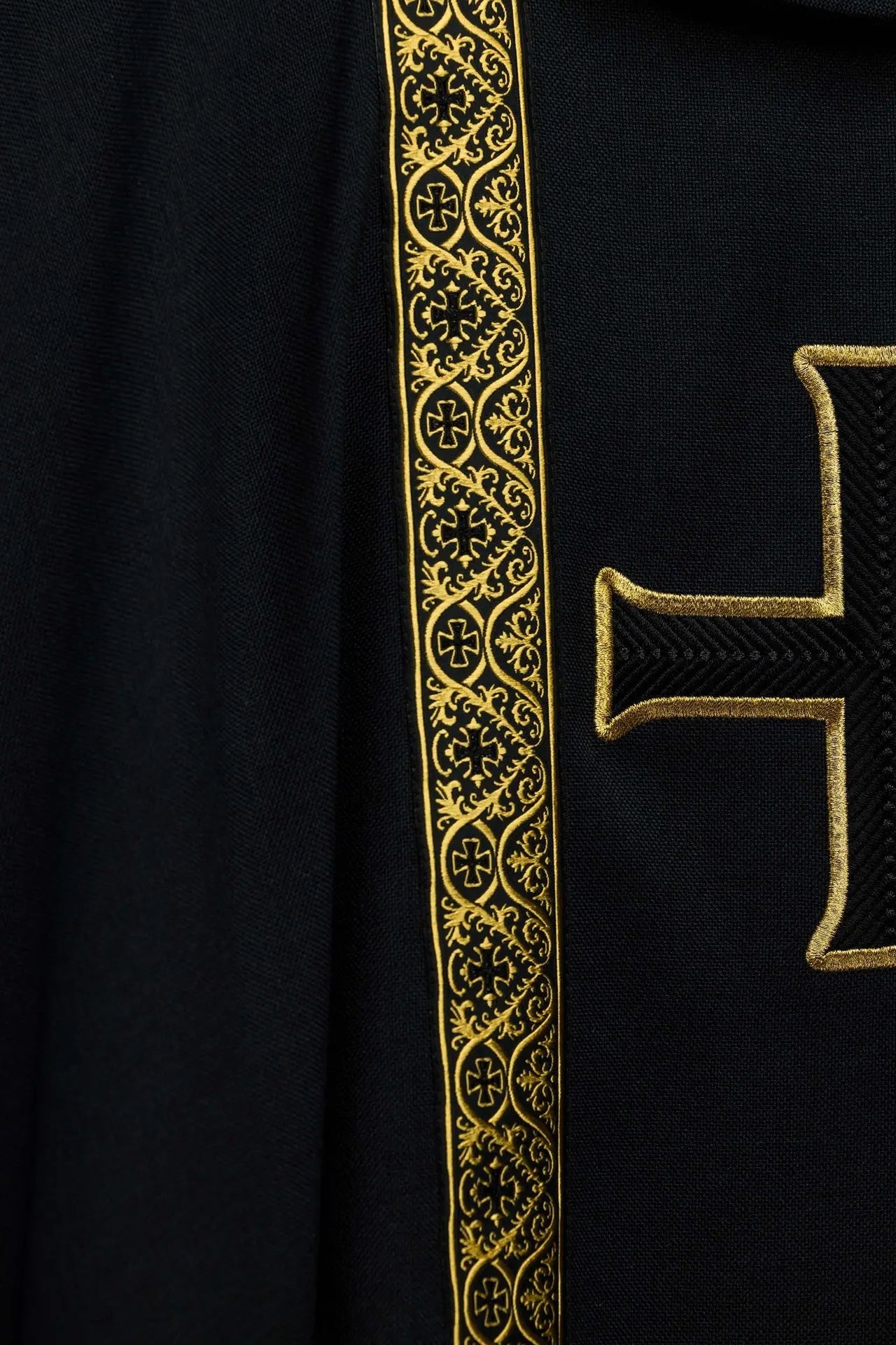 Black liturgical chasuble with embroidered cross and jacquard bands