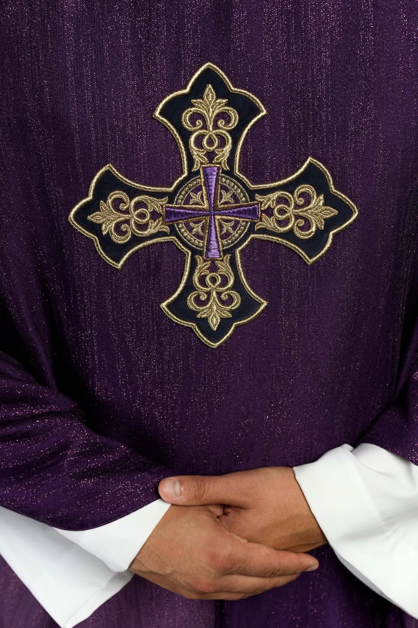 Purple chasuble with embroidered cross motif on de