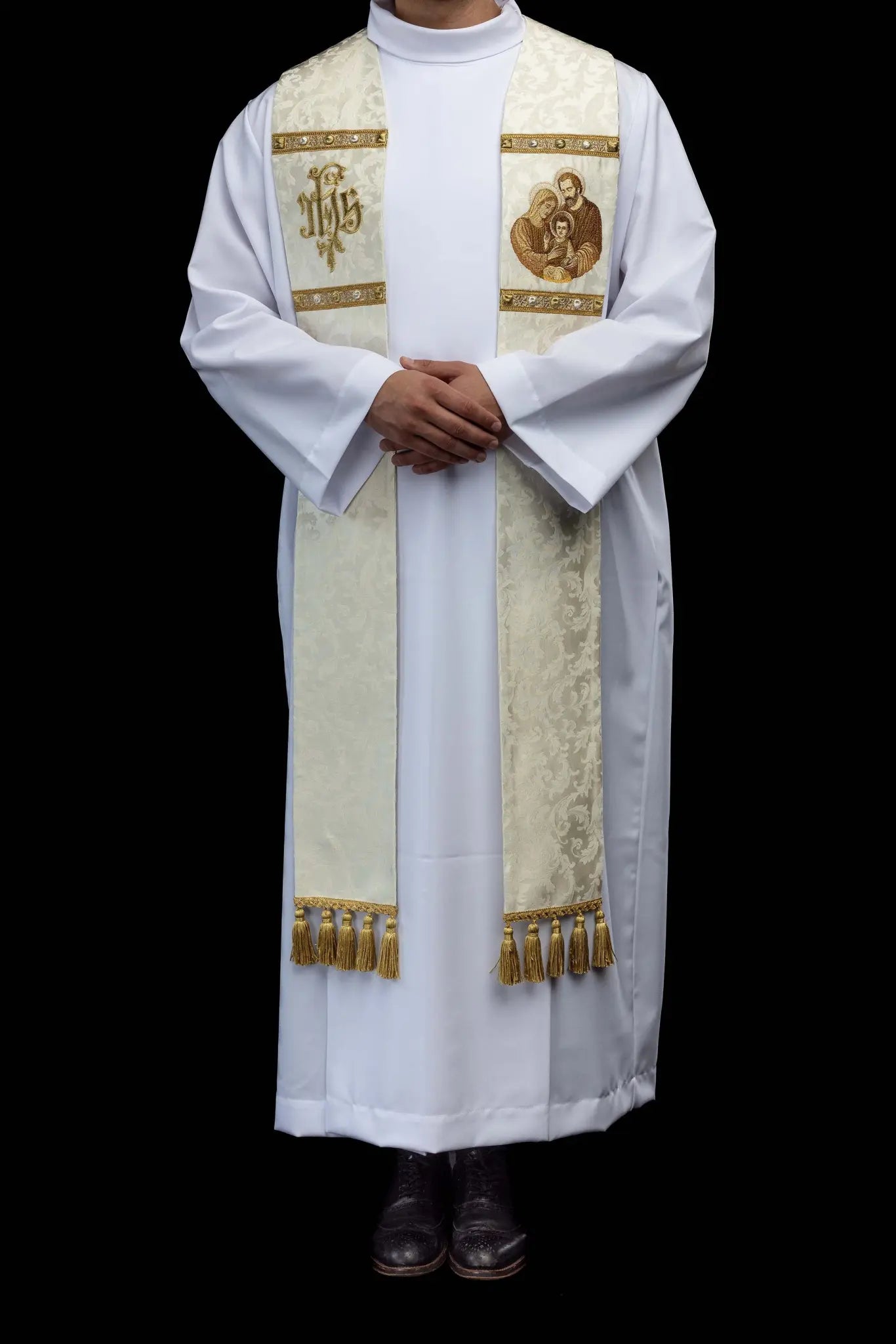 Ecru stole with Holy Family image on one side and IHS monogram on the other, featuring gold trim and tassels.