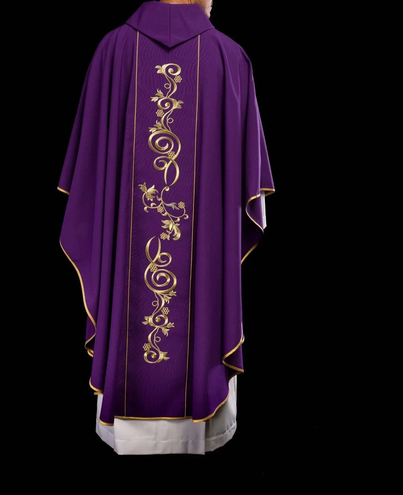 Richly decorated purple chasuble with gold motif and wide IHS band