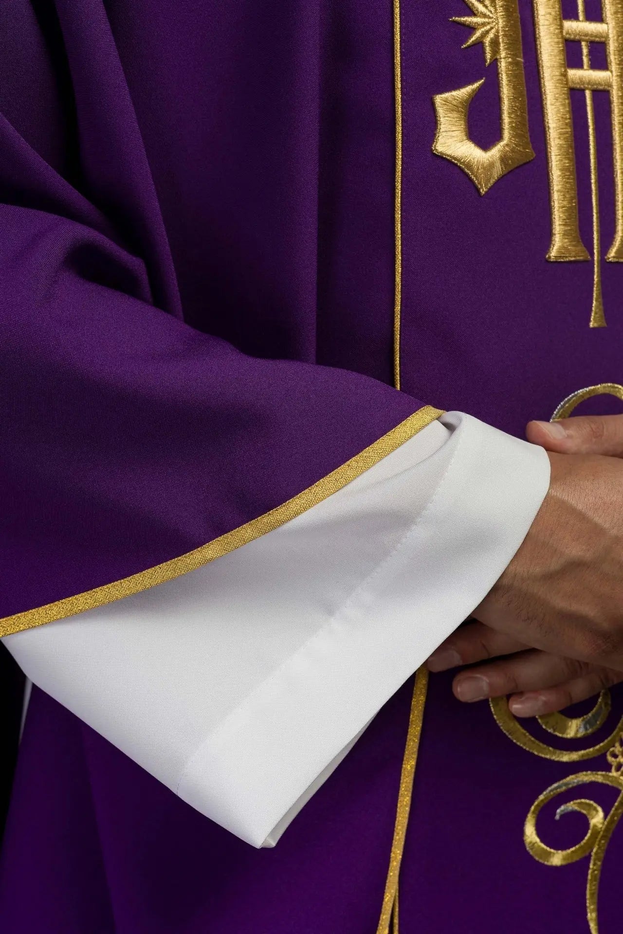 Richly decorated purple chasuble with gold motif and wide IHS band