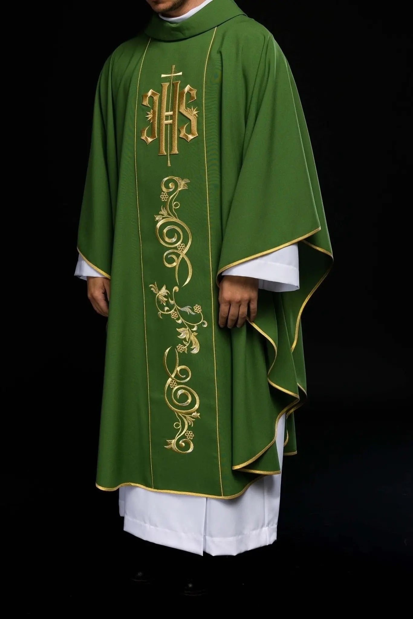 Richly decorated green chasuble with gold motif and wide IHS band
