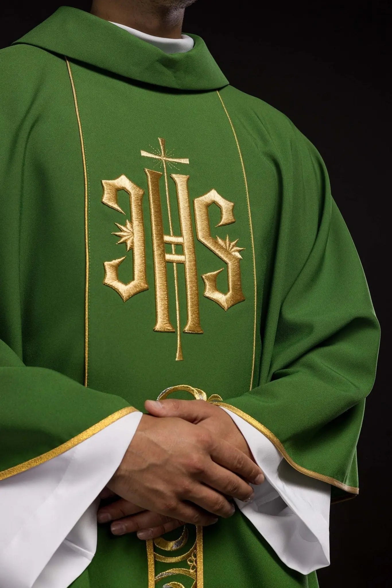 Richly decorated green chasuble with gold motif and wide IHS band