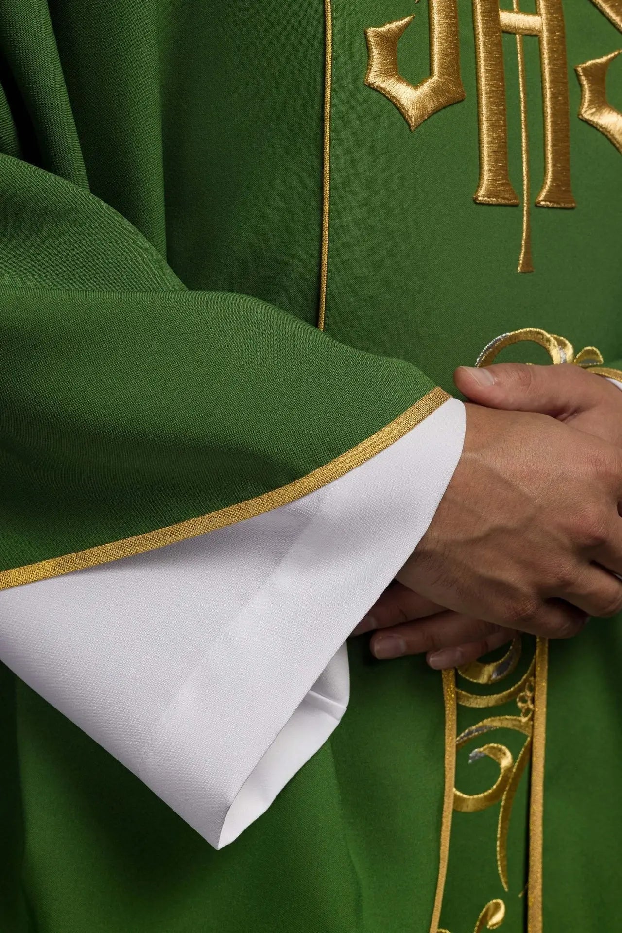 Richly decorated green chasuble with gold motif and wide IHS band