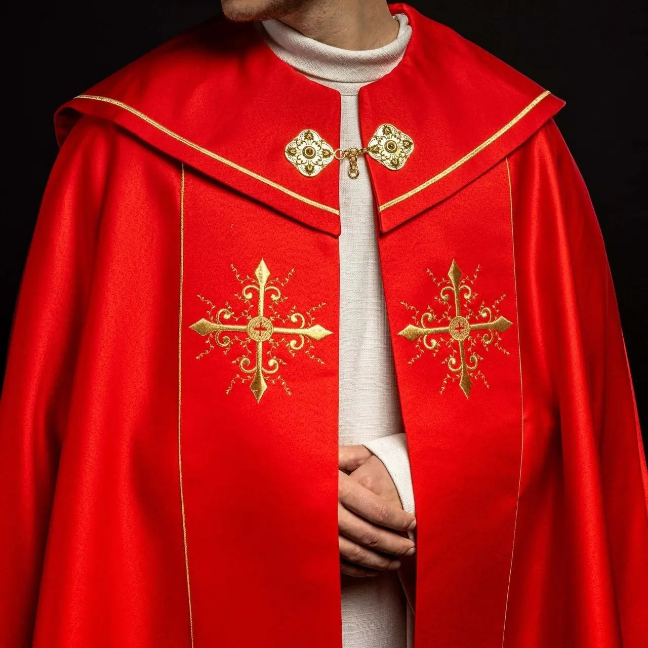 Red liturgical cope with gold crosses embroidery