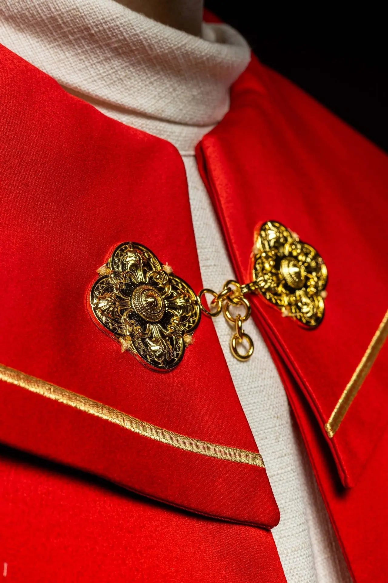 Red liturgical cope with gold crosses embroidery