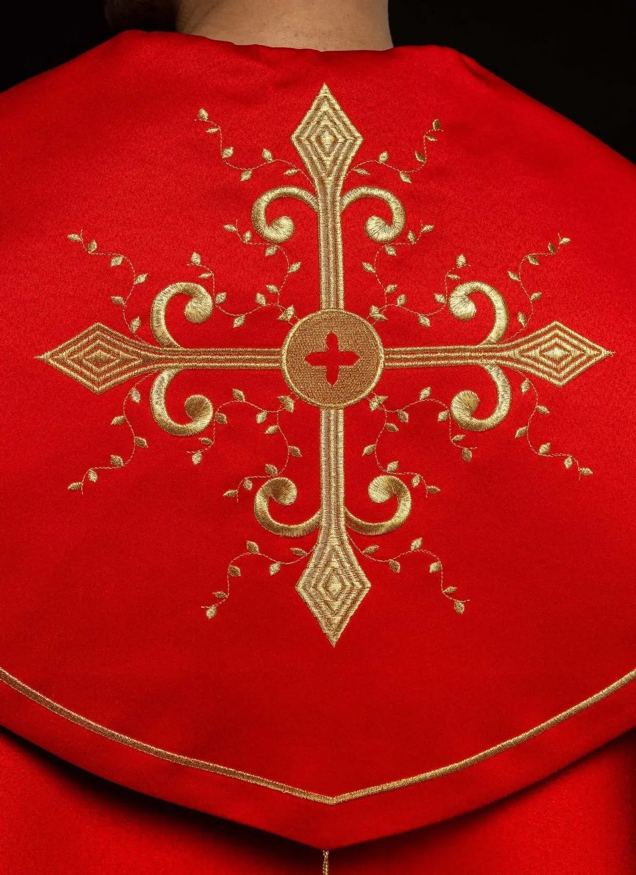 Red liturgical cope with gold crosses embroidery