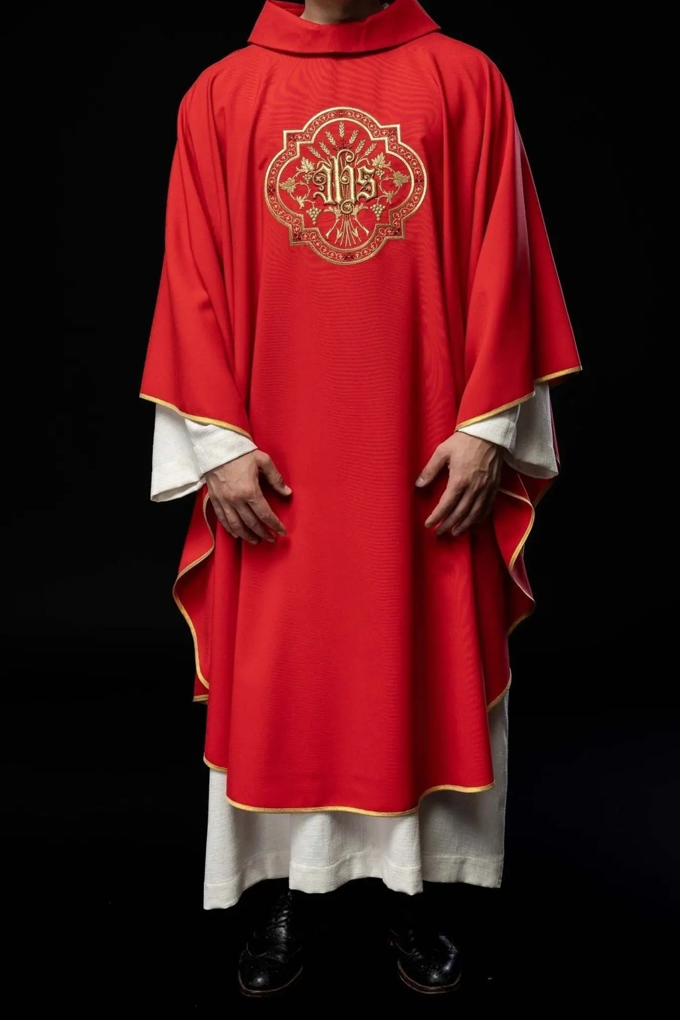Red chasuble with IHS and PAX embroidery