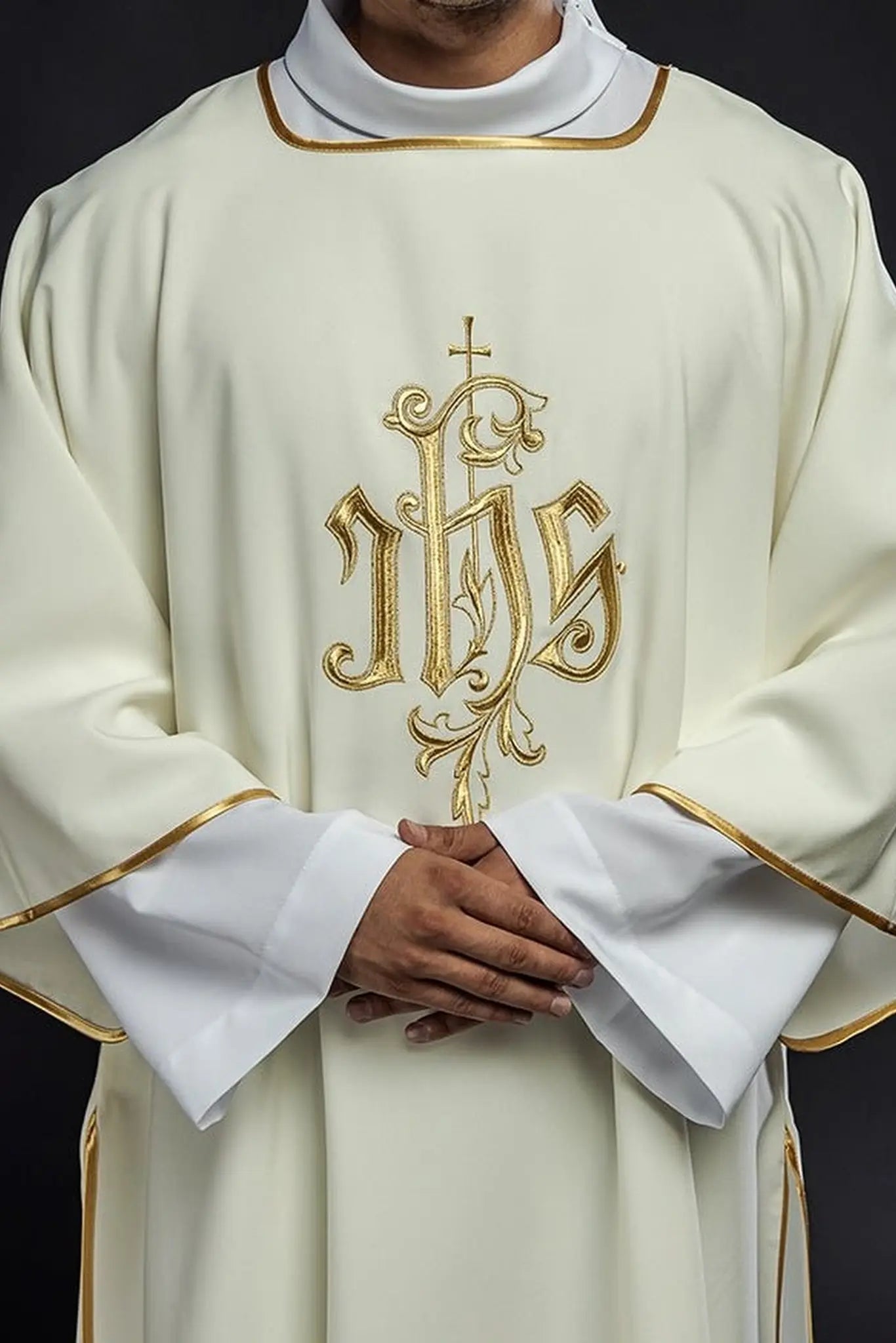 Dalmatics with IHS embroidery in ecru