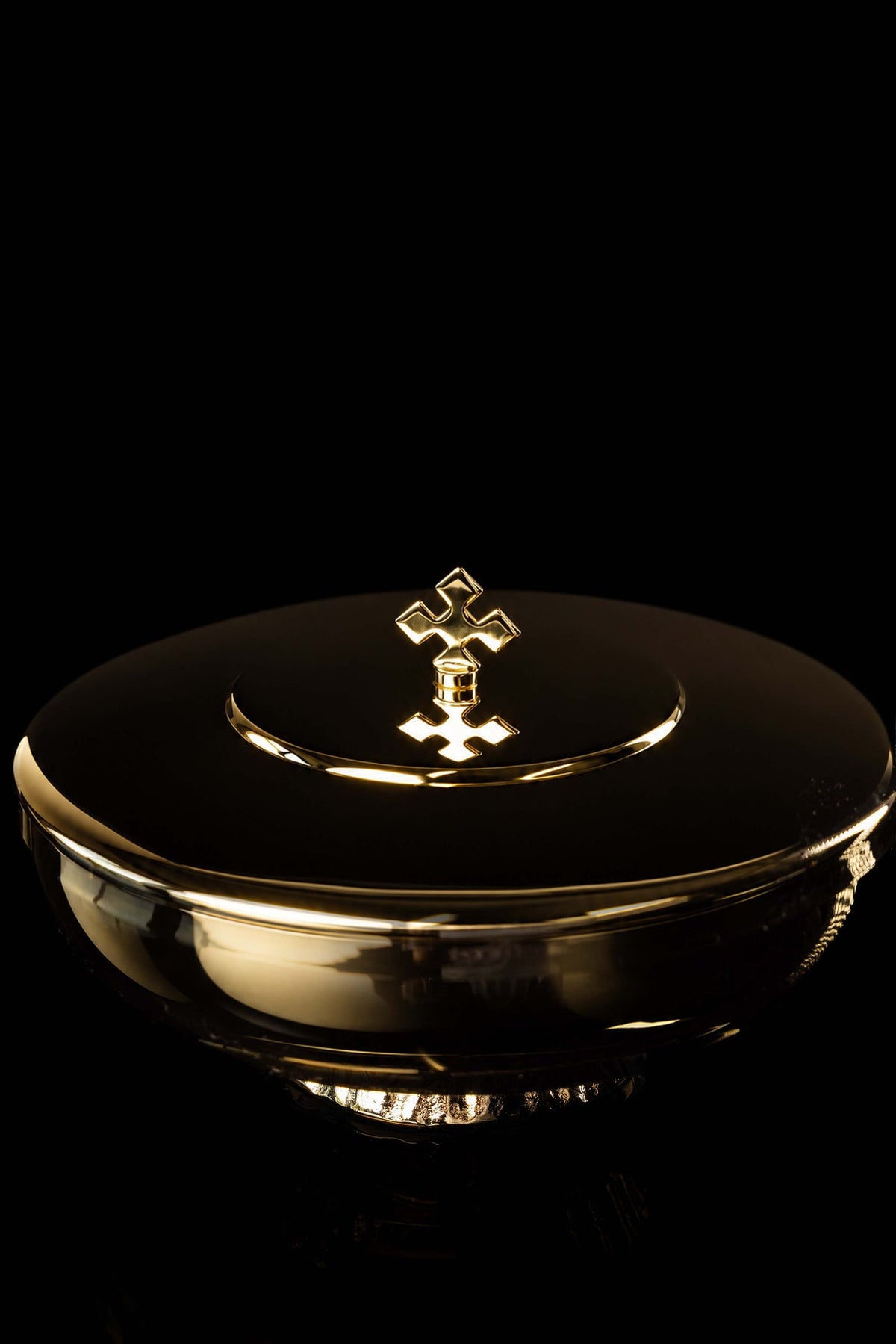 Gold-plated ciborium with decorative cross, elevated front view