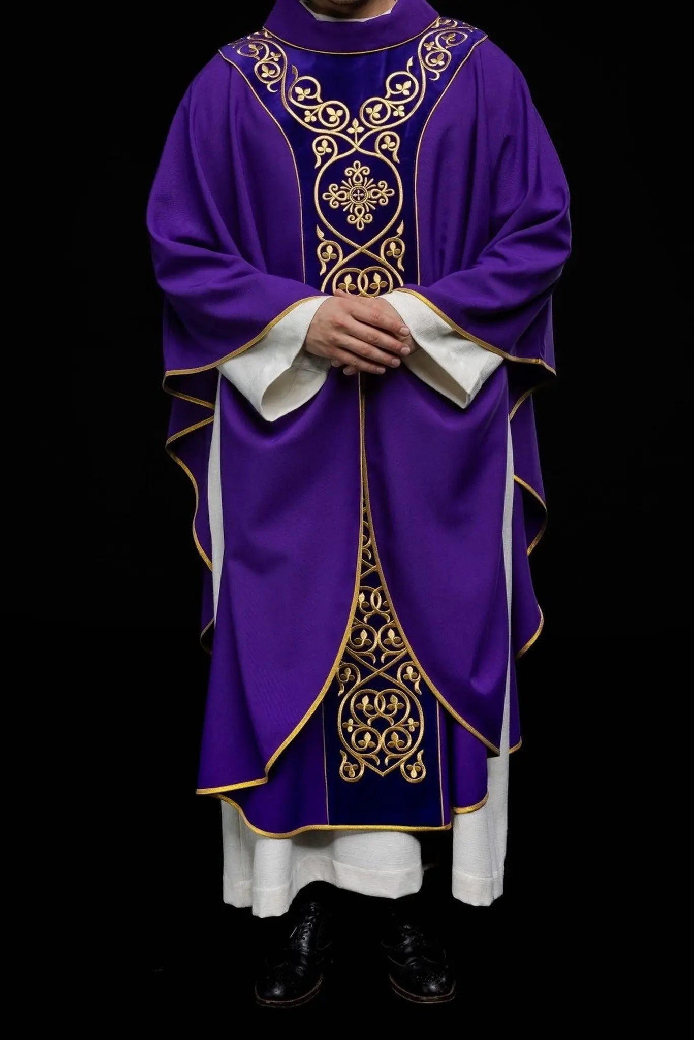 Purple liturgical chasuble decorated with embroidery on velvet