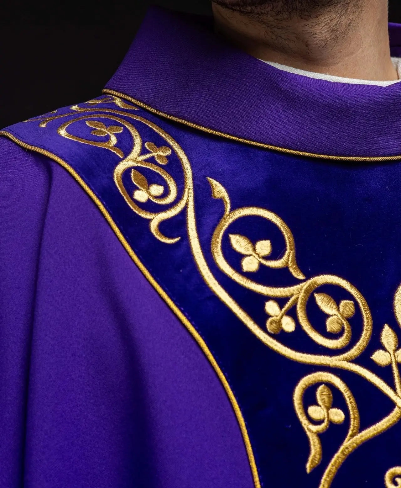 Purple liturgical chasuble decorated with embroidery on velvet