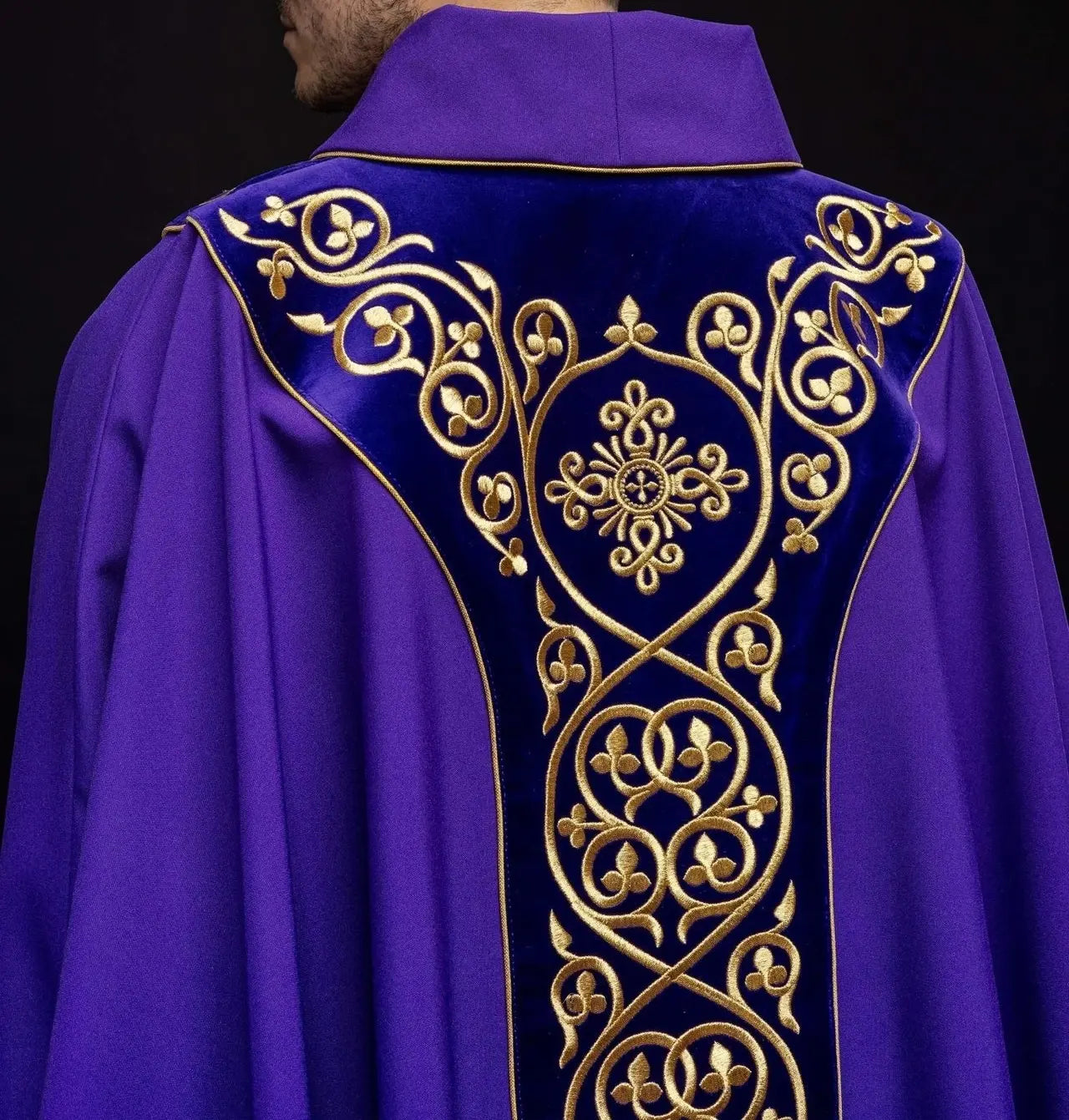 Purple liturgical chasuble decorated with embroidery on velvet
