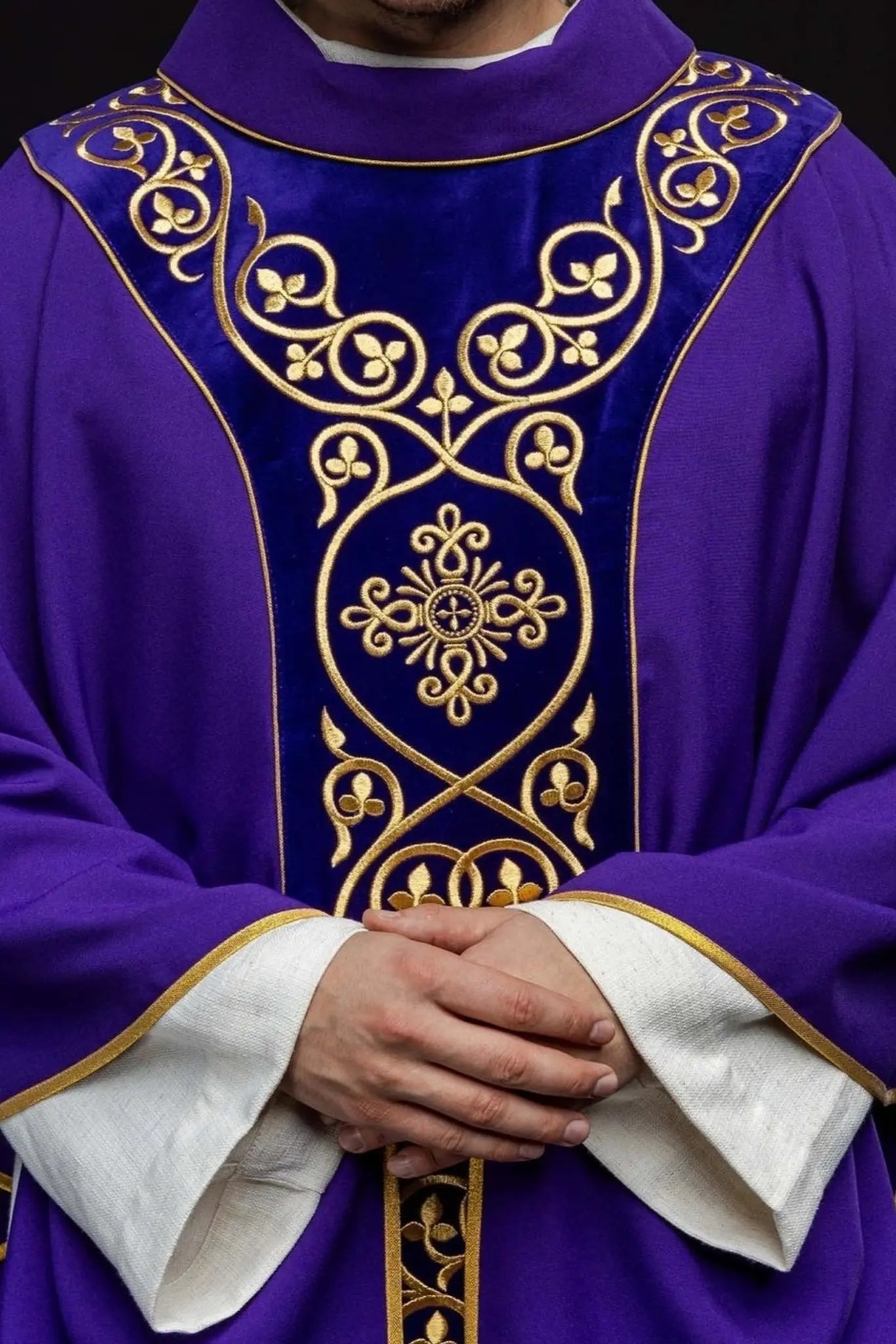 Purple liturgical chasuble decorated with embroidery on velvet