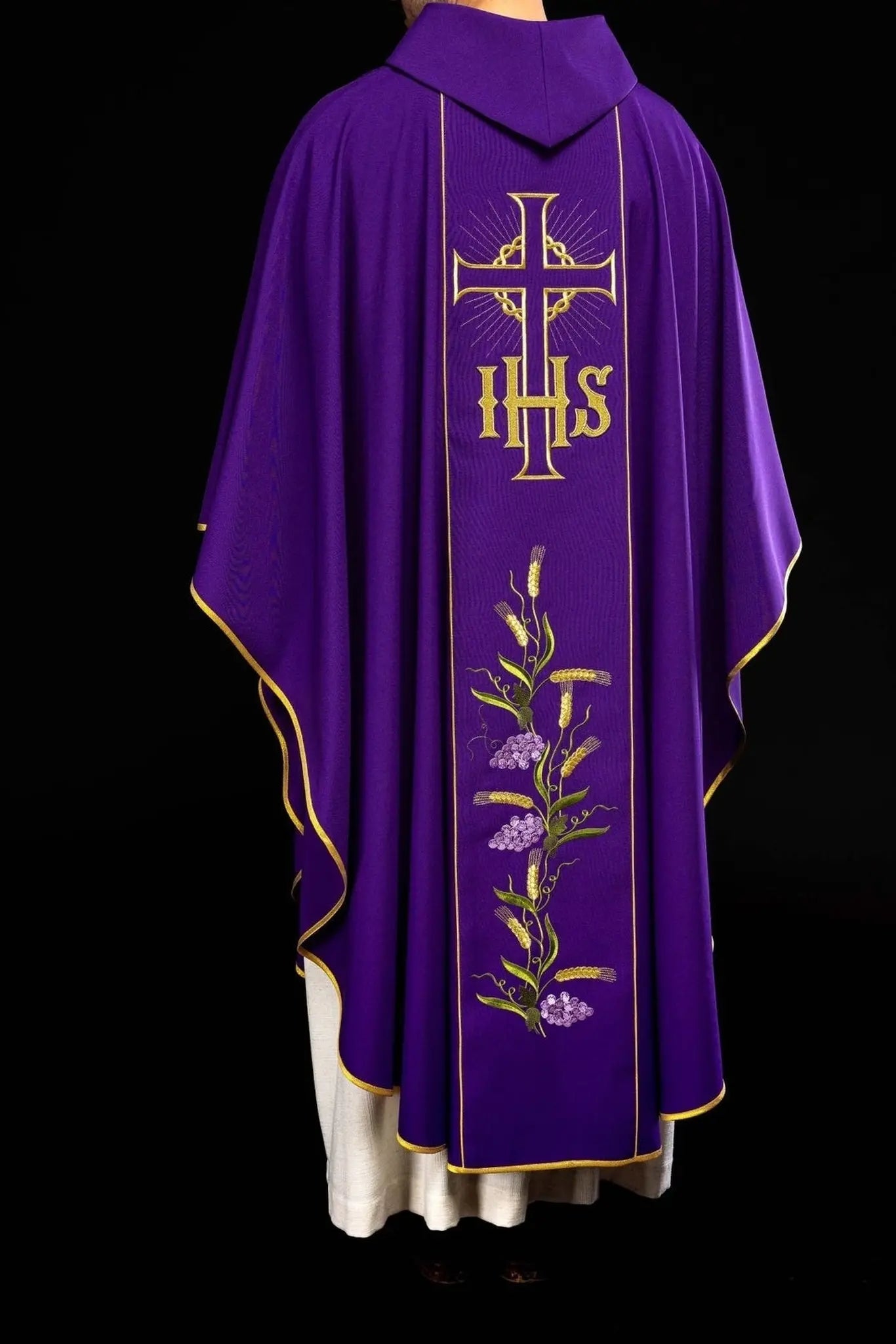 Purple chasuble with decorated gold belt with IHS and ears