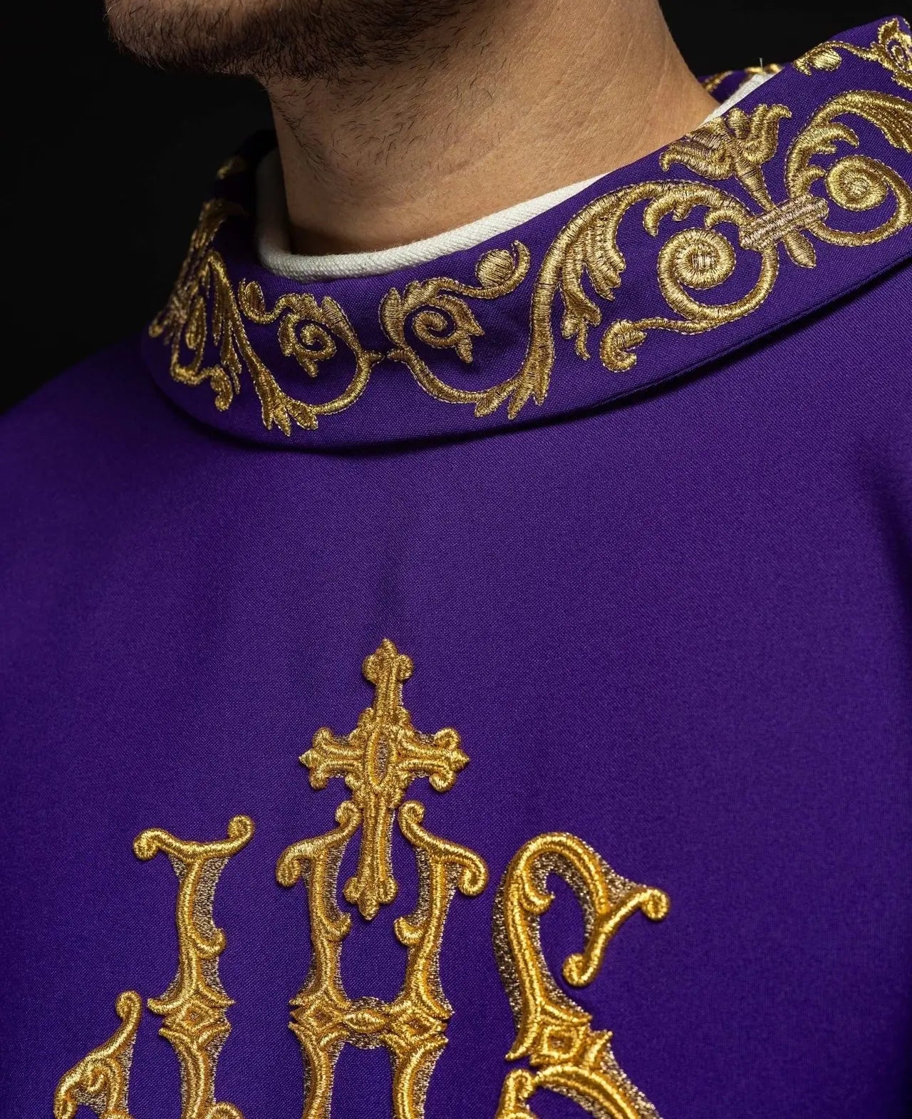 Purple chasuble with gold IHS embroidery and decorative trim