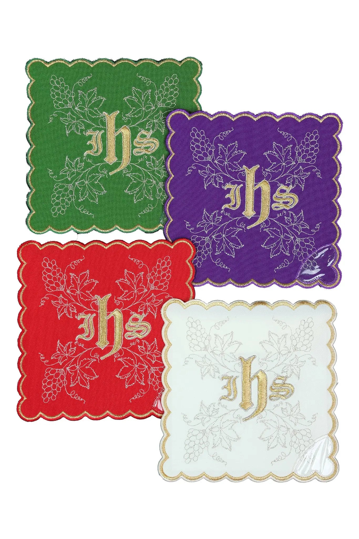 Set of four liturgical palls in green, purple, red, and white, each with a gold embroidered JHS symbol and vine motif.