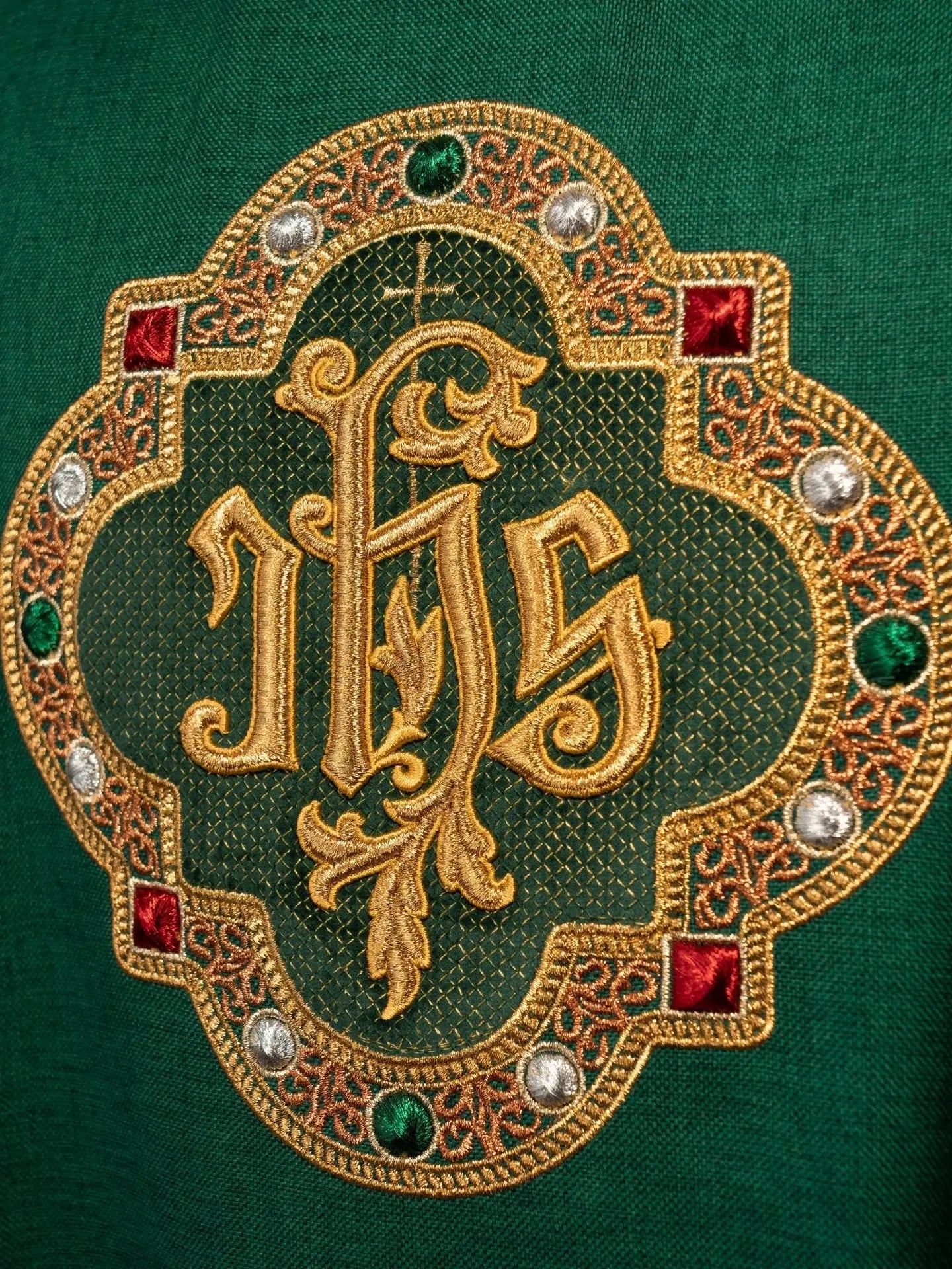 Chasuble with richly embroidered belt and piping around IHS embroidery and collar in green