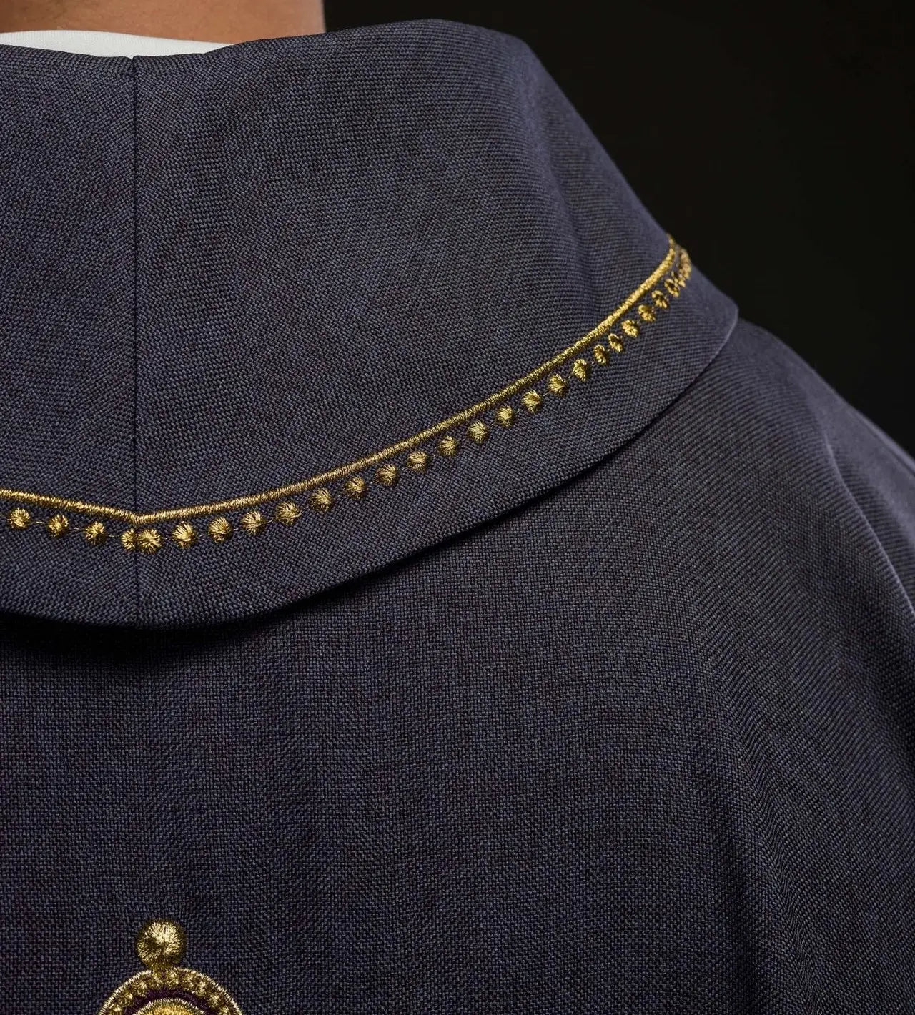 Chasuble with embroidered cross and gold trim on the collar in purple