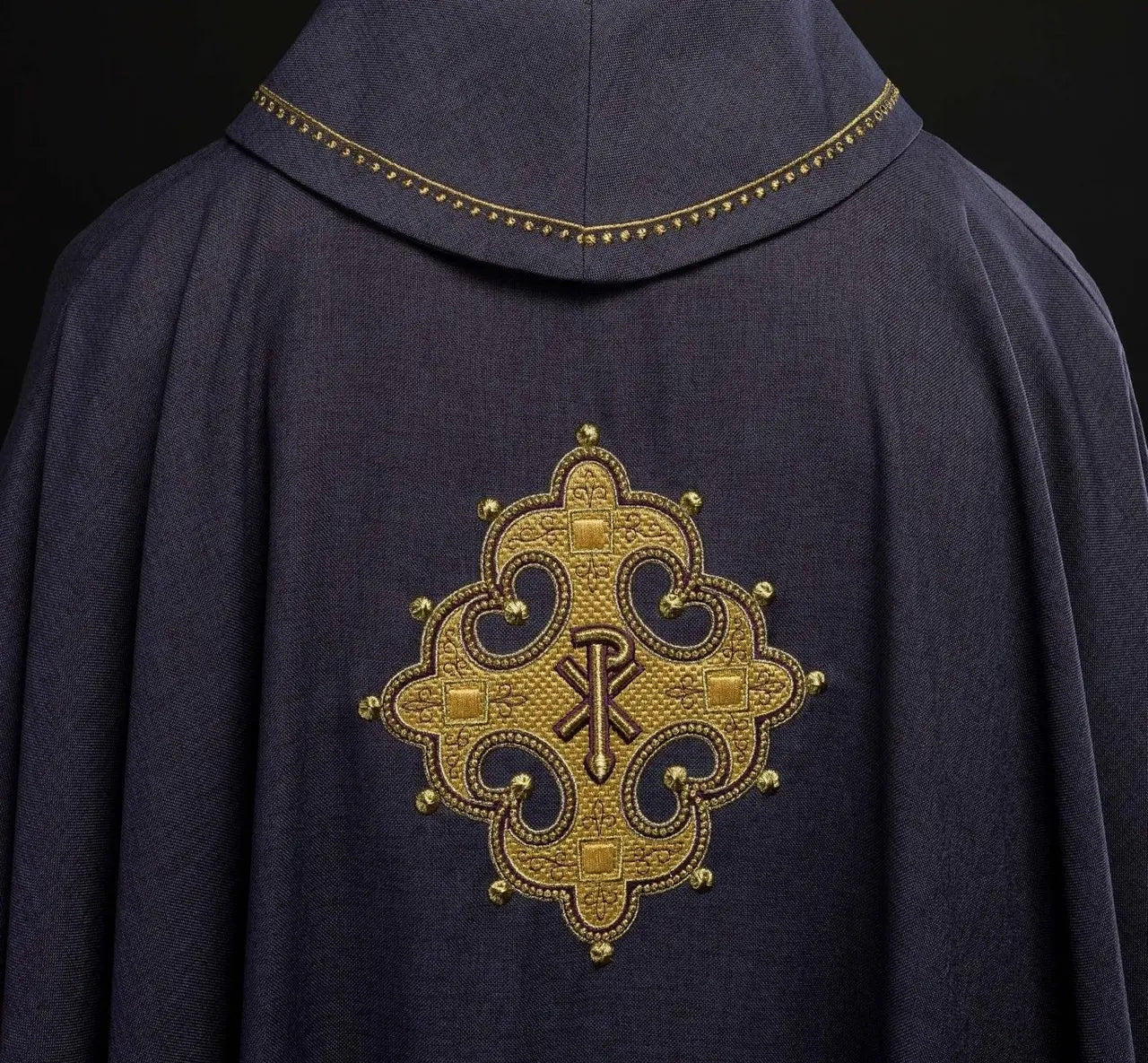 Chasuble with embroidered cross and gold trim on the collar in purple