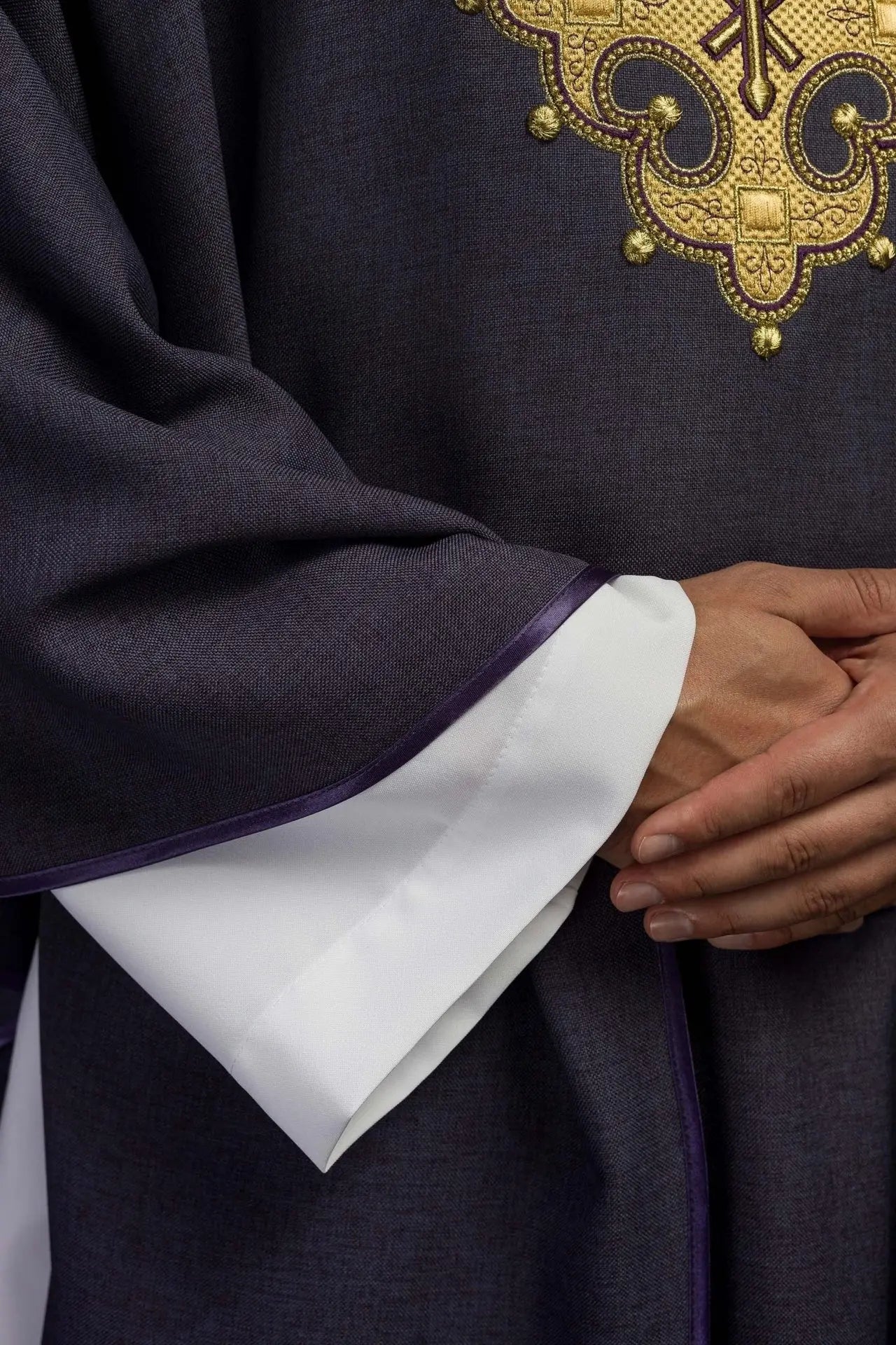 Chasuble with embroidered cross and gold trim on the collar in purple