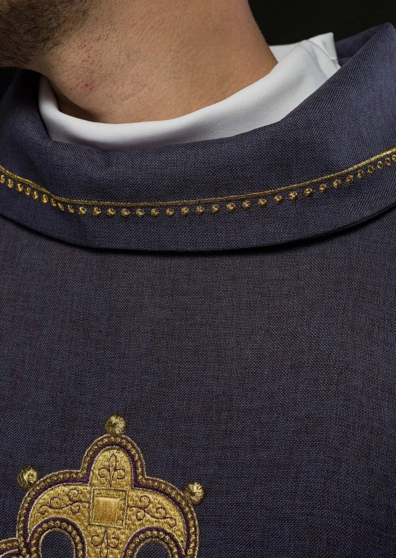 Chasuble with embroidered cross and gold trim on the collar in purple