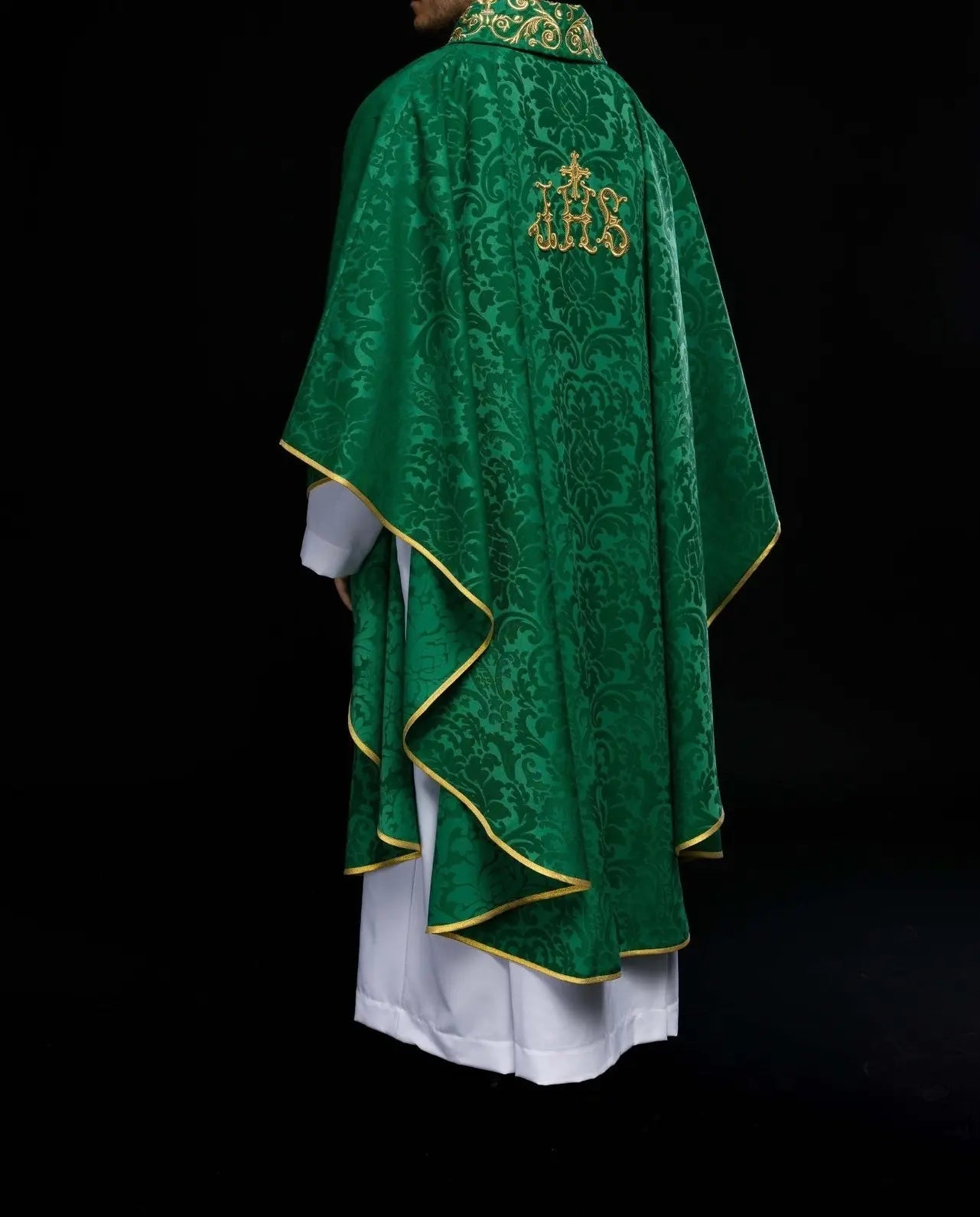 Green chasuble with IHS motif and richly embroidered collar on decorative fabric