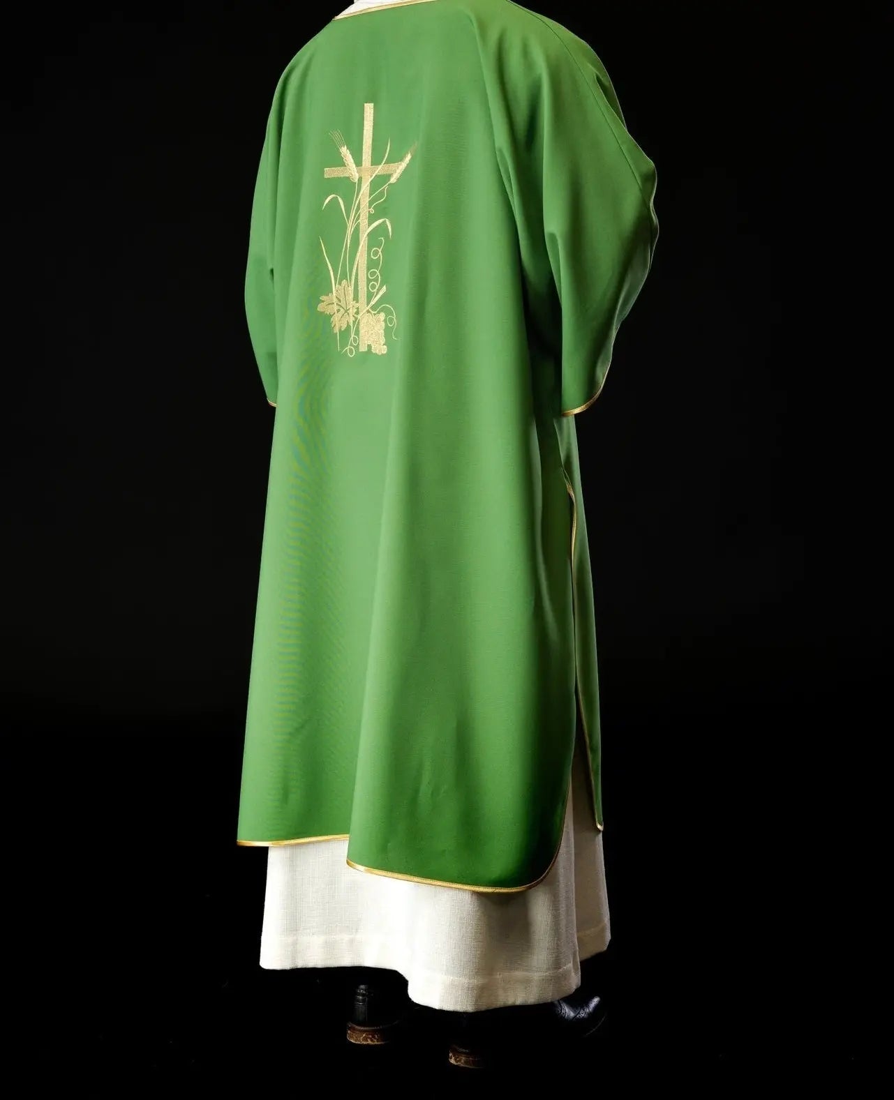 Green dalmatics with gold Pax cross embroidery