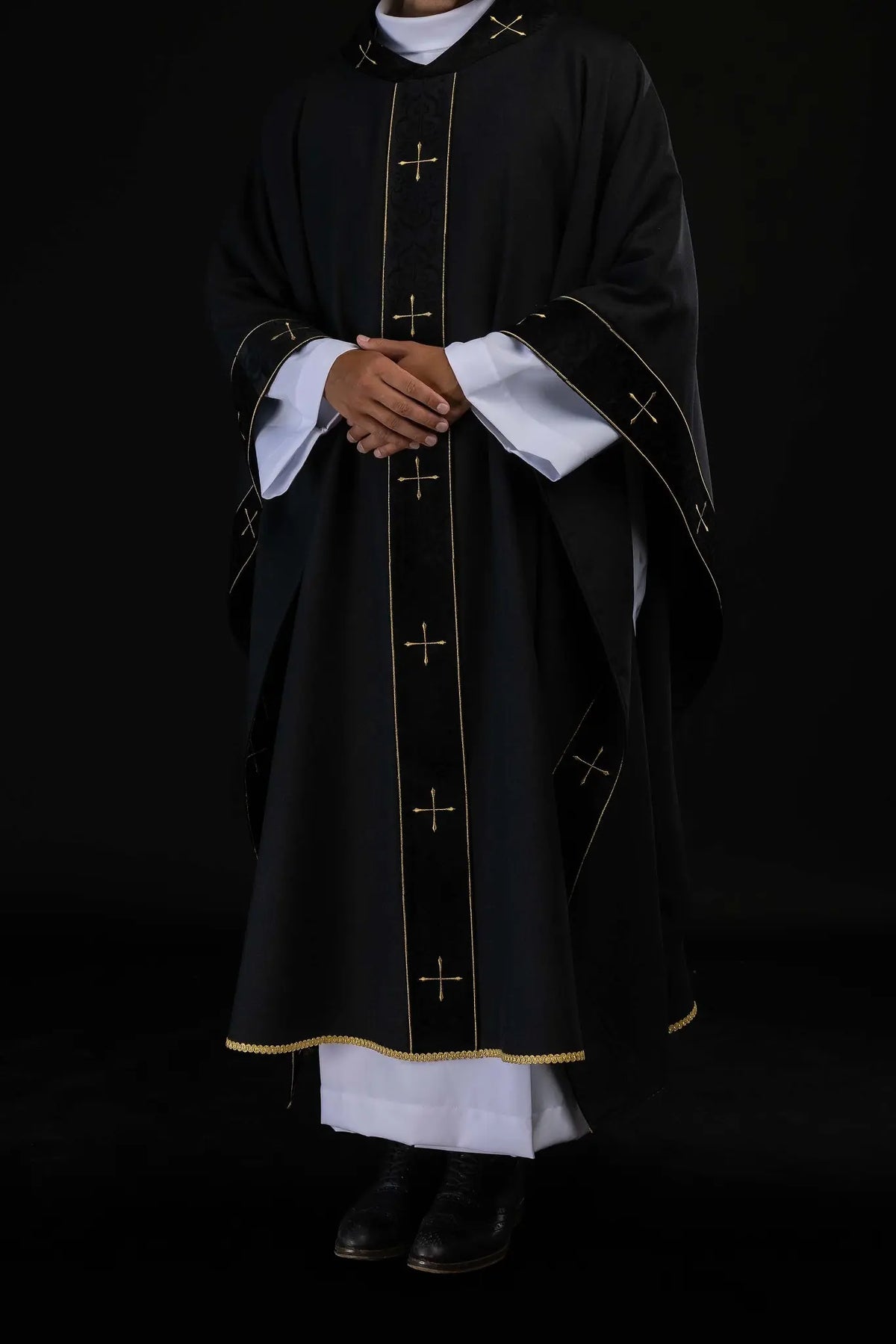 Black chasuble with gold crosses, full front worn view