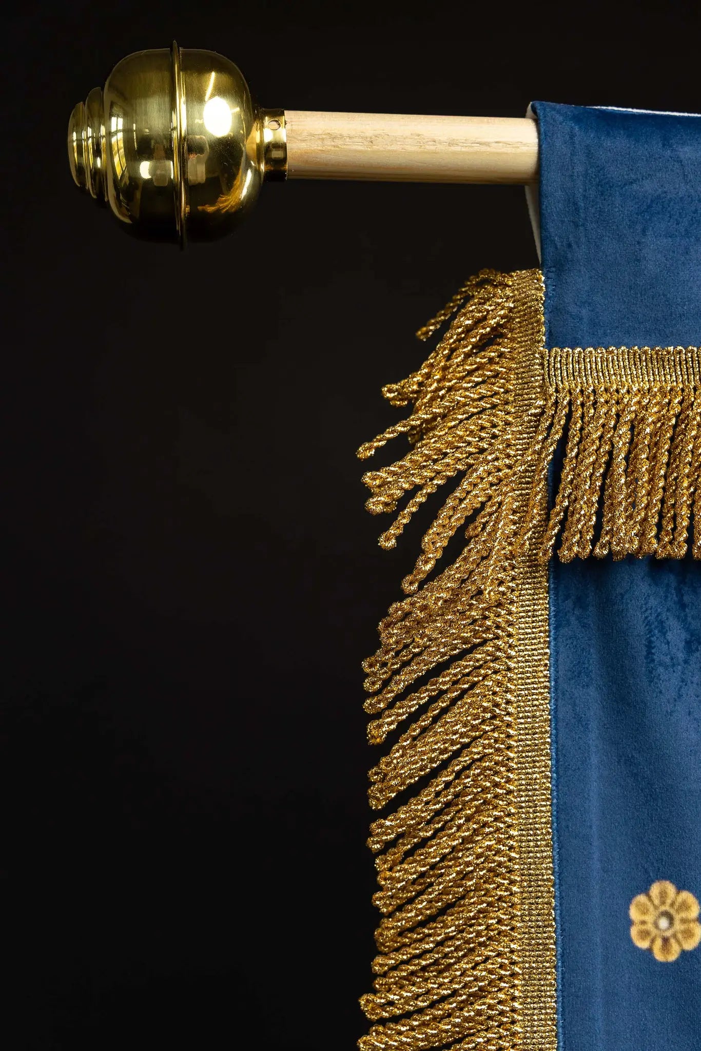 Double-sided processional banner with Our Lady of the Assumption on one side and a Marian monogram on the other, made of velour fabric with gold ornaments and fringes.